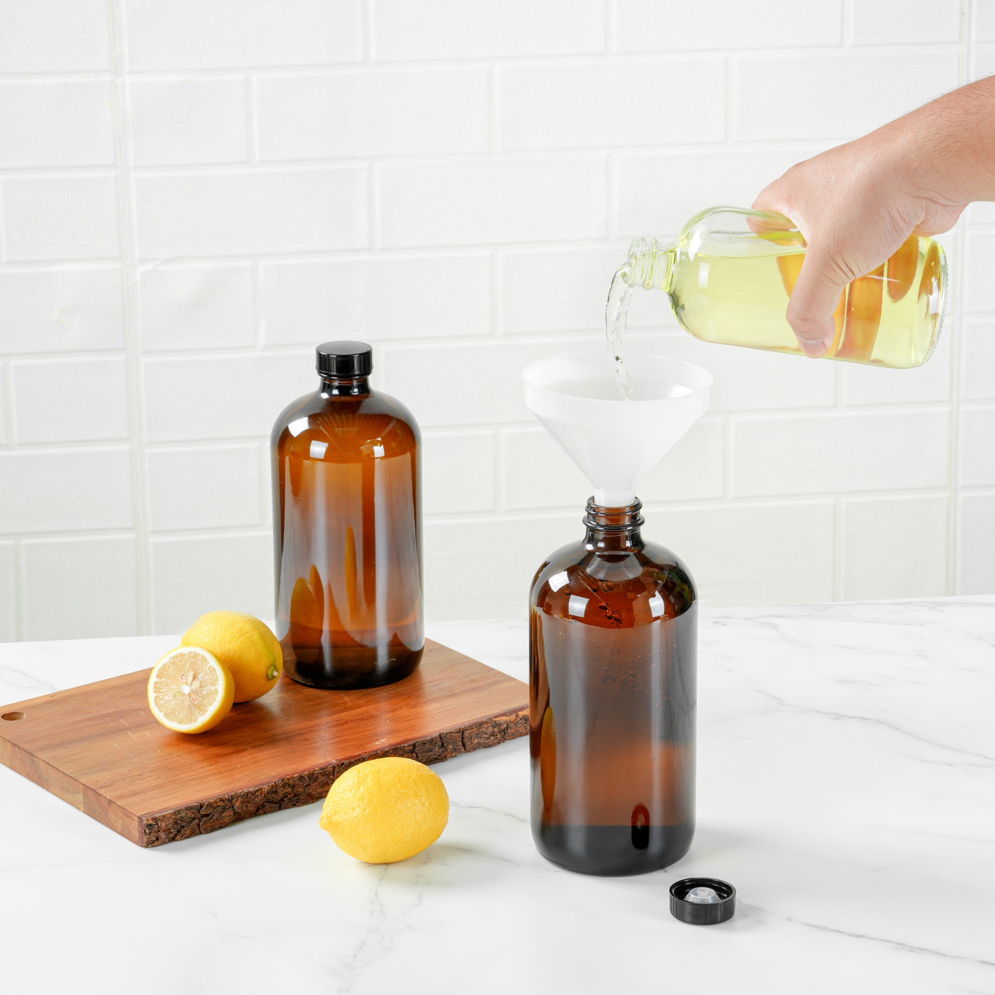 Vetri 32 oz Boston Round Amber Glass Bottle - with Black Phenolic Cap - 3 3/4" x 3 3/4" x 8" - 12 count box