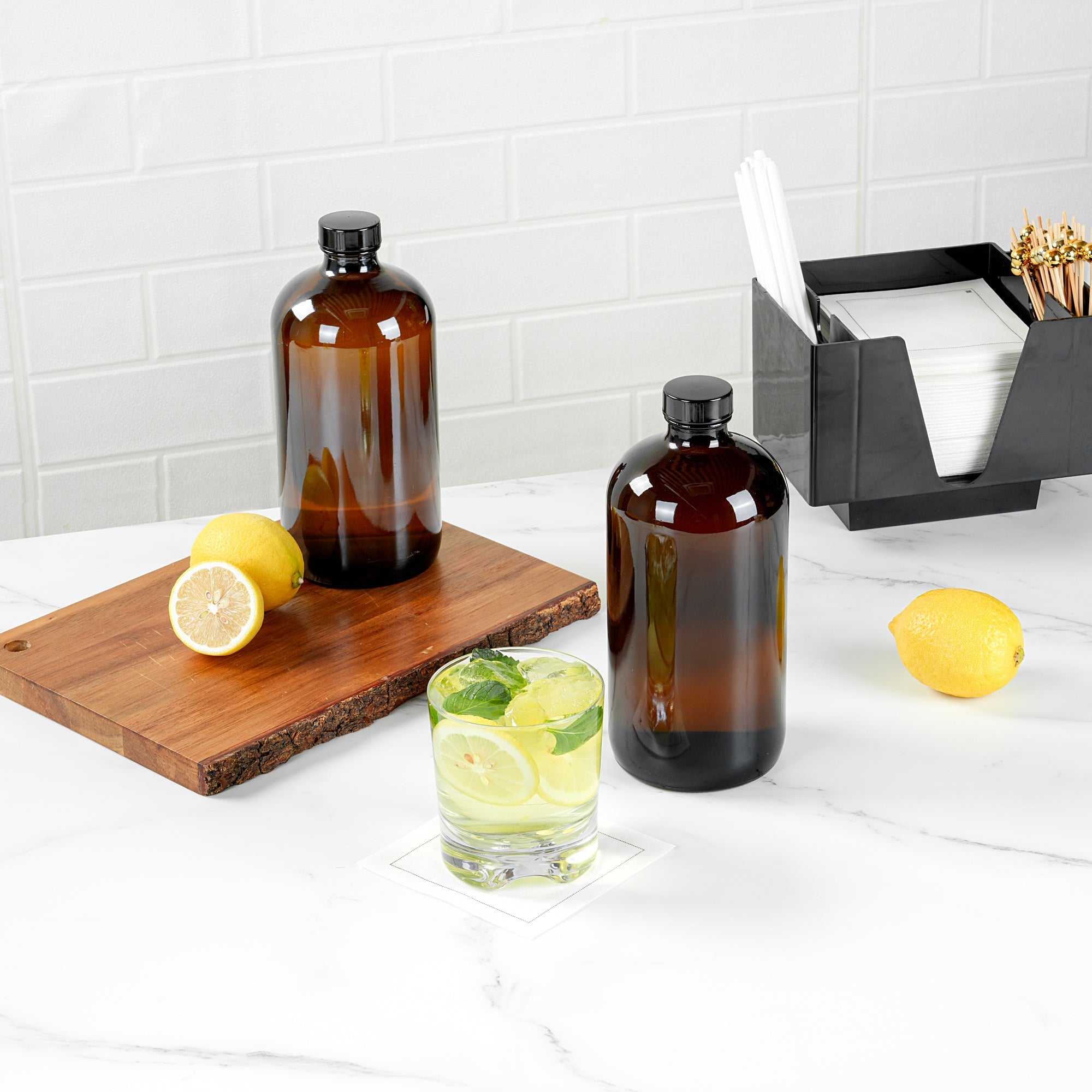 Vetri 32 oz Boston Round Amber Glass Bottle - with Black Phenolic Cap - 3 3/4" x 3 3/4" x 8" - 12 count box