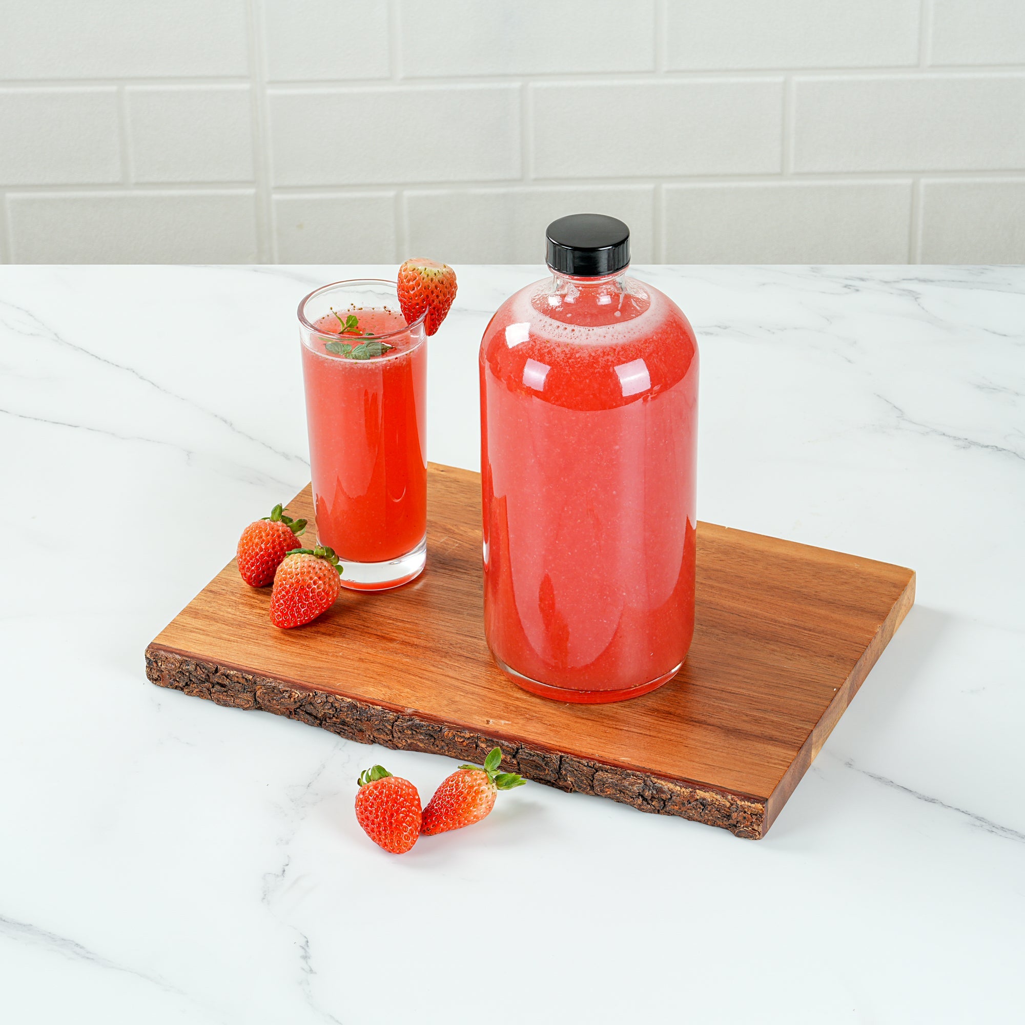 Vetri 32 oz Boston Round Clear Glass Bottle - with Black Phenolic Cap - 3 3/4" x 3 3/4" x 8" - 12 count box