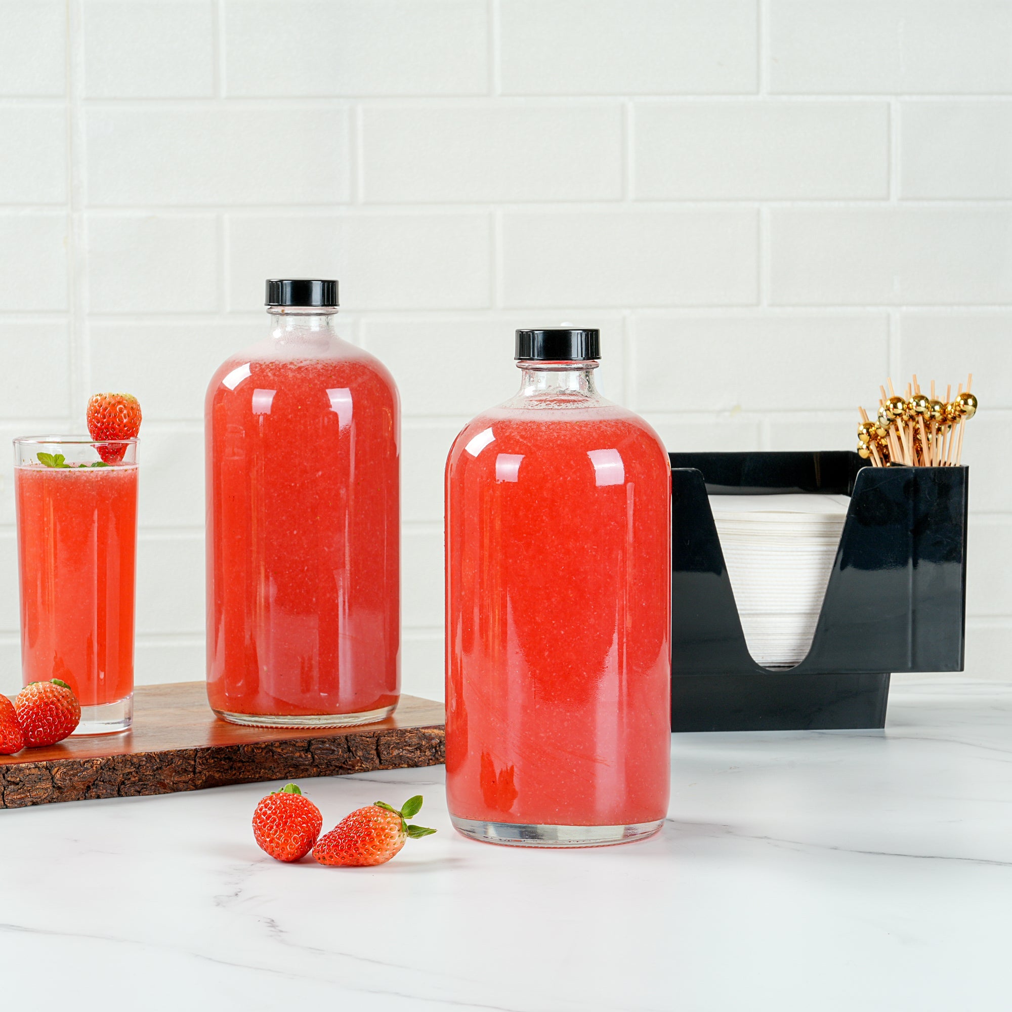 Vetri 32 oz Boston Round Clear Glass Bottle - with Black Phenolic Cap - 3 3/4" x 3 3/4" x 8" - 12 count box