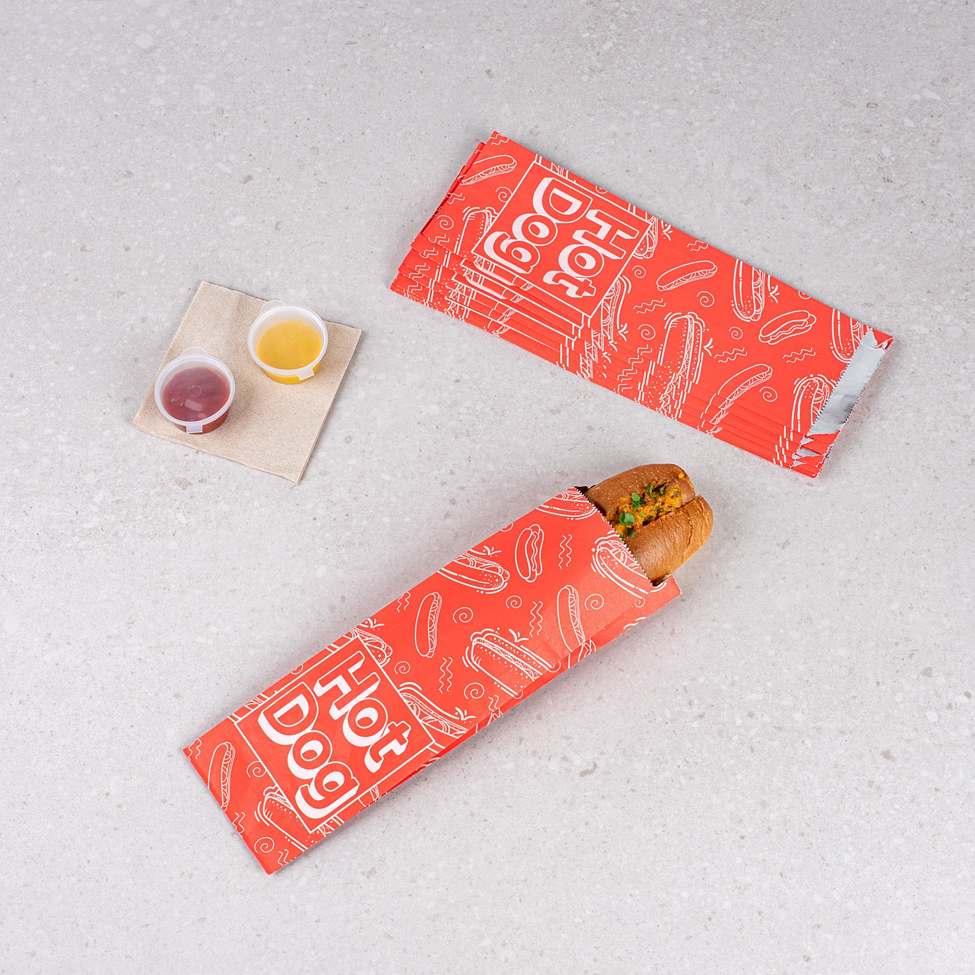 Bag Tek Red Paper Printed Large Hot Dog Foil Bag - 3 3/4" x 1 1/4" x 12" - 100 count box