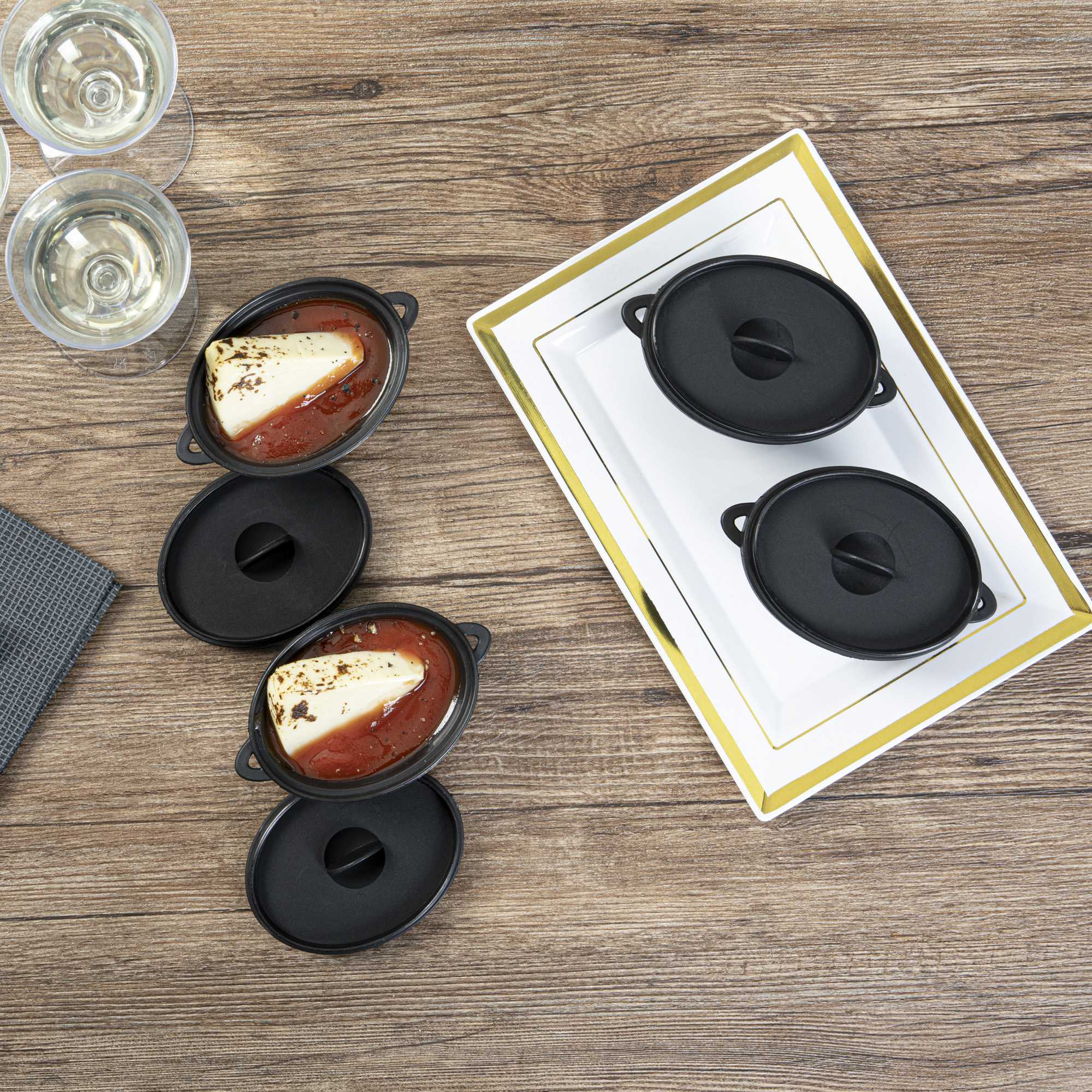 Mini Serve 3 oz Oval Black Plastic Mini Kettle Dish - 3" x 2 1/4" x 1 1/2" - 100 count box