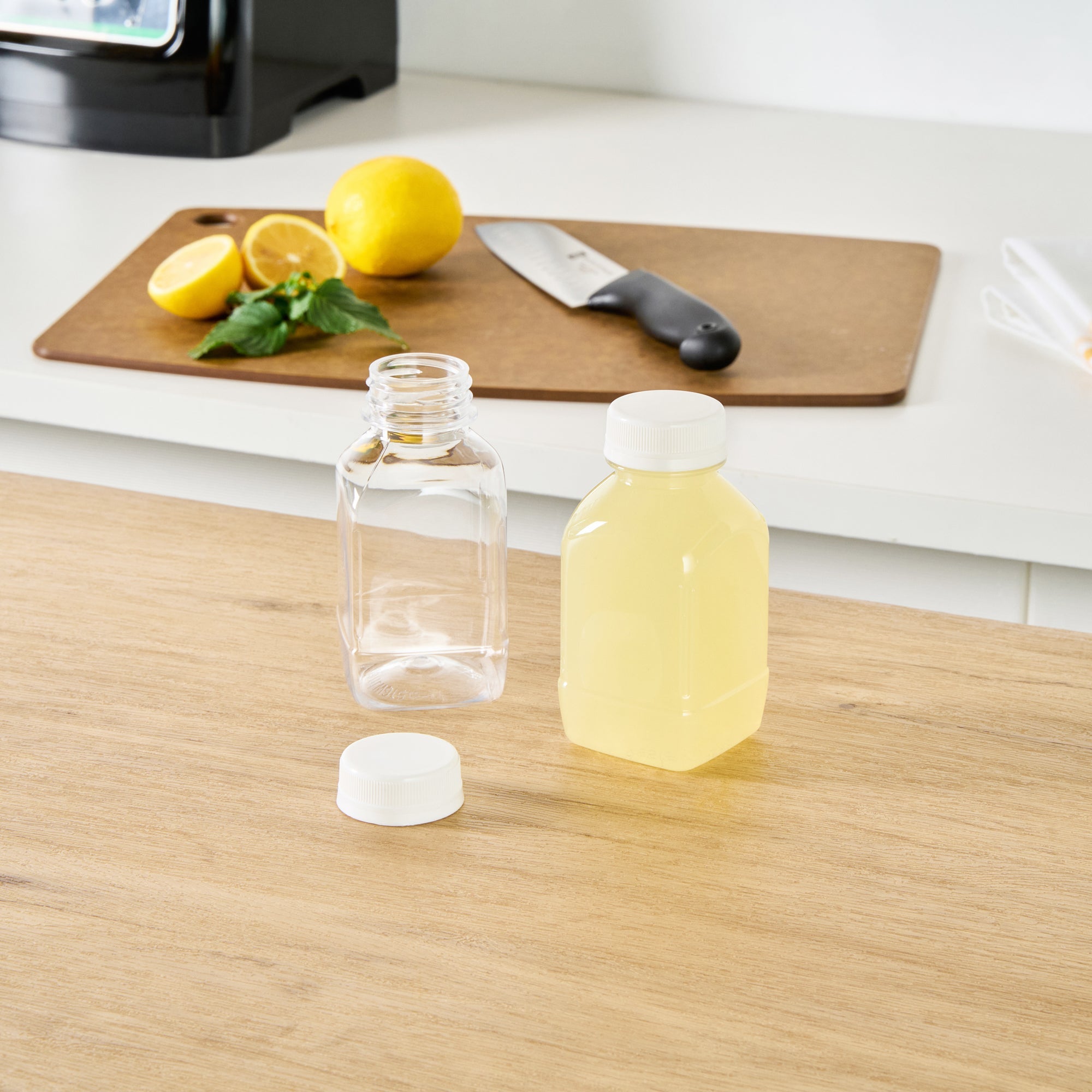 Bottle Tek 8 oz Square Clear Plastic Cold Pressed Juice Bottle - with Safety Cap - 2 1/4" x 2 1/4" x 4 3/4" - 100 count box