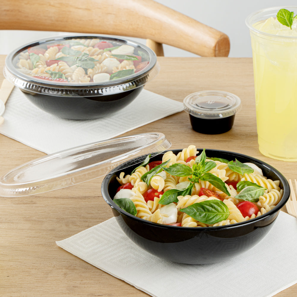 Maxi Serve 21 oz Round Black Plastic Salad Bowl - 6 3/4" x 6 3/4" x 2 1/2" - 200 count box