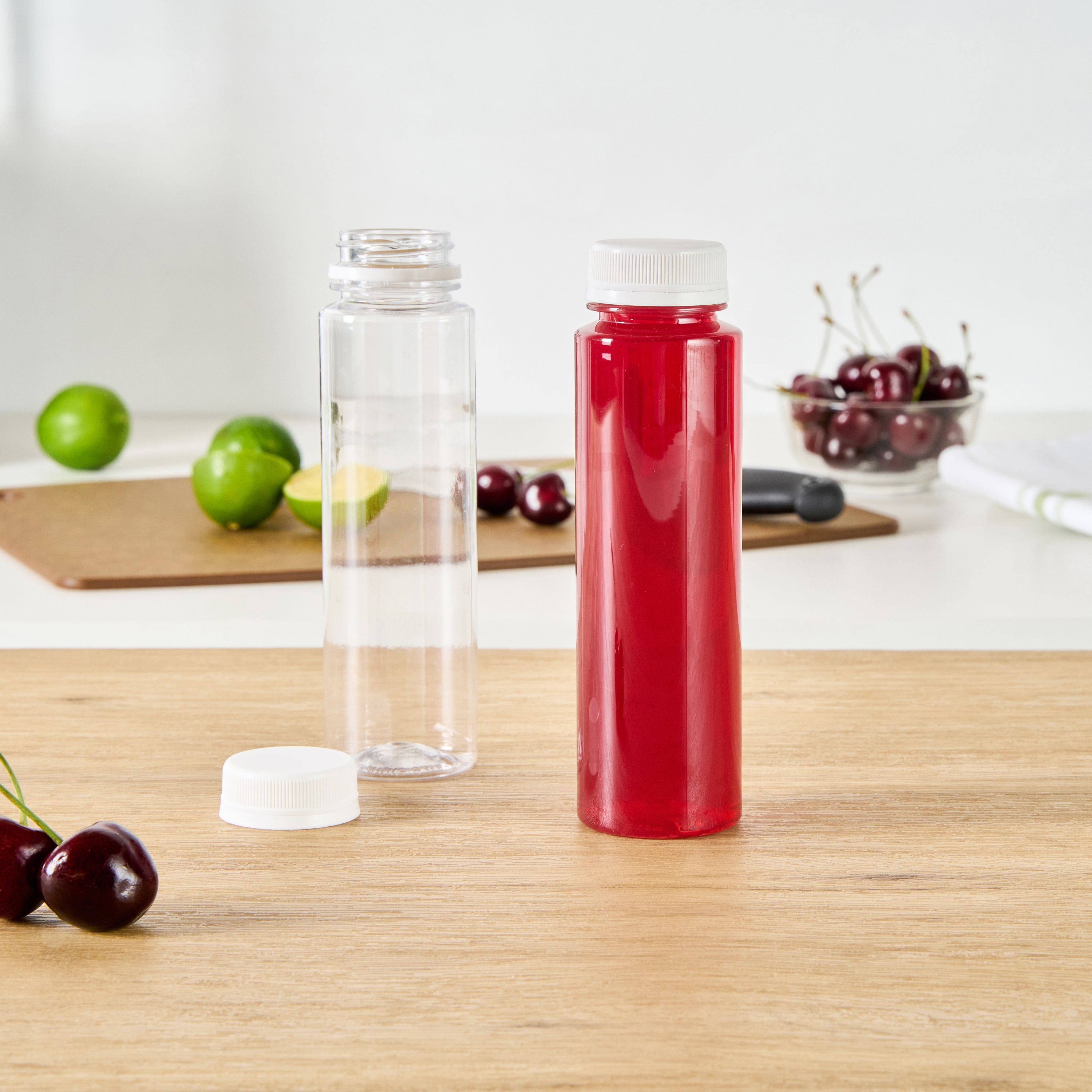 Bottle Tek 8 oz Round Clear Plastic Cold Pressed Juice Bottle - with Safety Cap - 2" x 2" x 6 3/4" - 100 count box