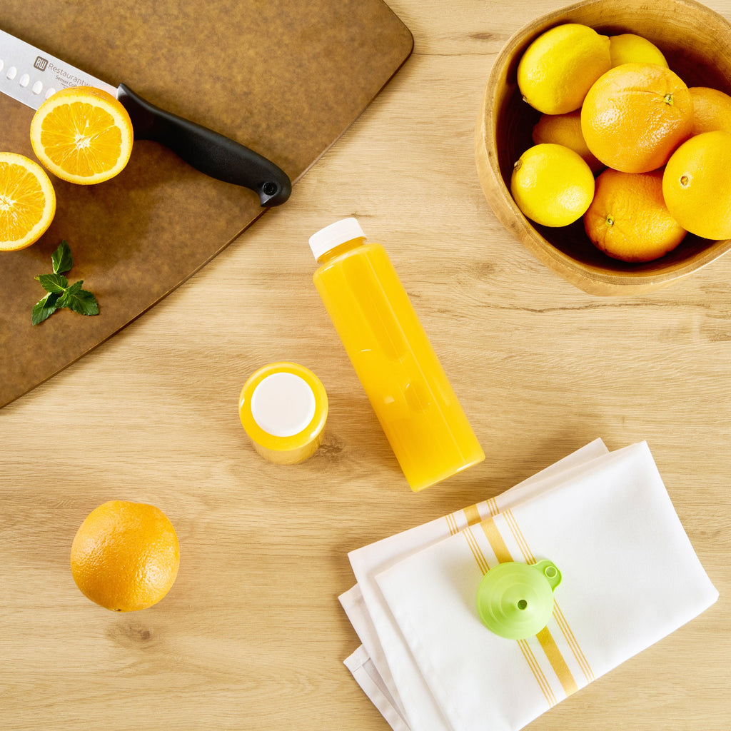 Bottle Tek 16 oz Round Clear Plastic Cold Pressed Juice Bottle - with Safety Cap - 2 1/4" x 2 1/4" x 8 1/4" - 100 count box