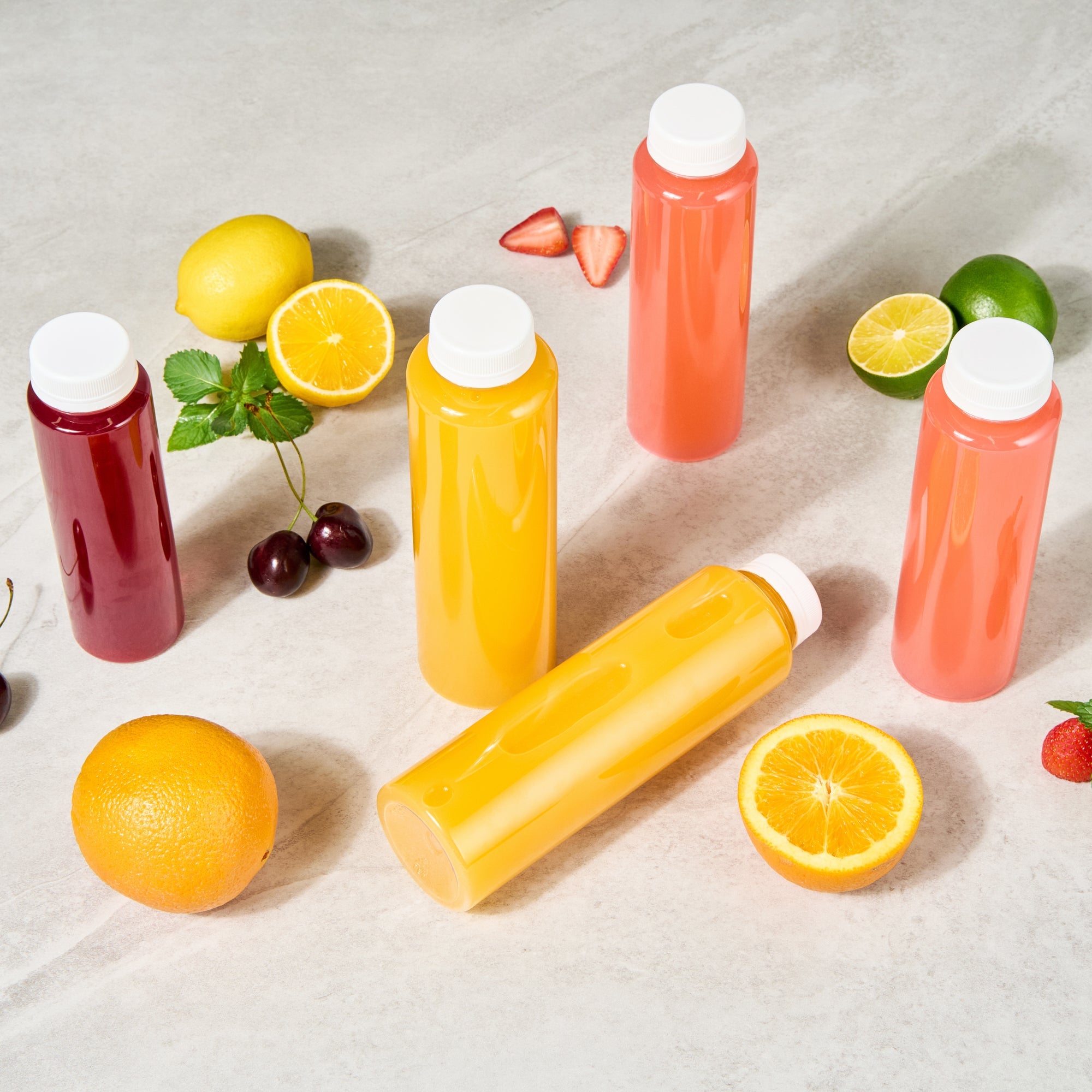 Bottle Tek 16 oz Round Clear Plastic Cold Pressed Juice Bottle - with Safety Cap - 2 1/4" x 2 1/4" x 8 1/4" - 100 count box