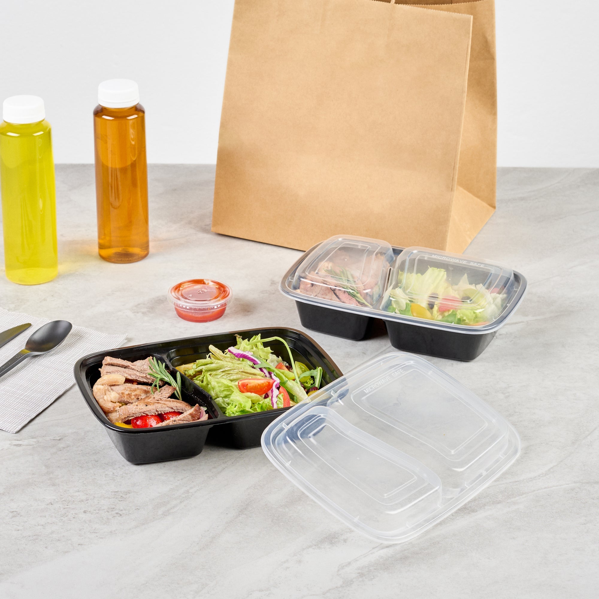 Asporto 32 oz Black Plastic 2 Compartment Food Container - with Clear Lid, Microwavable - 8 3/4" x 6" x 2" - 50 count box
