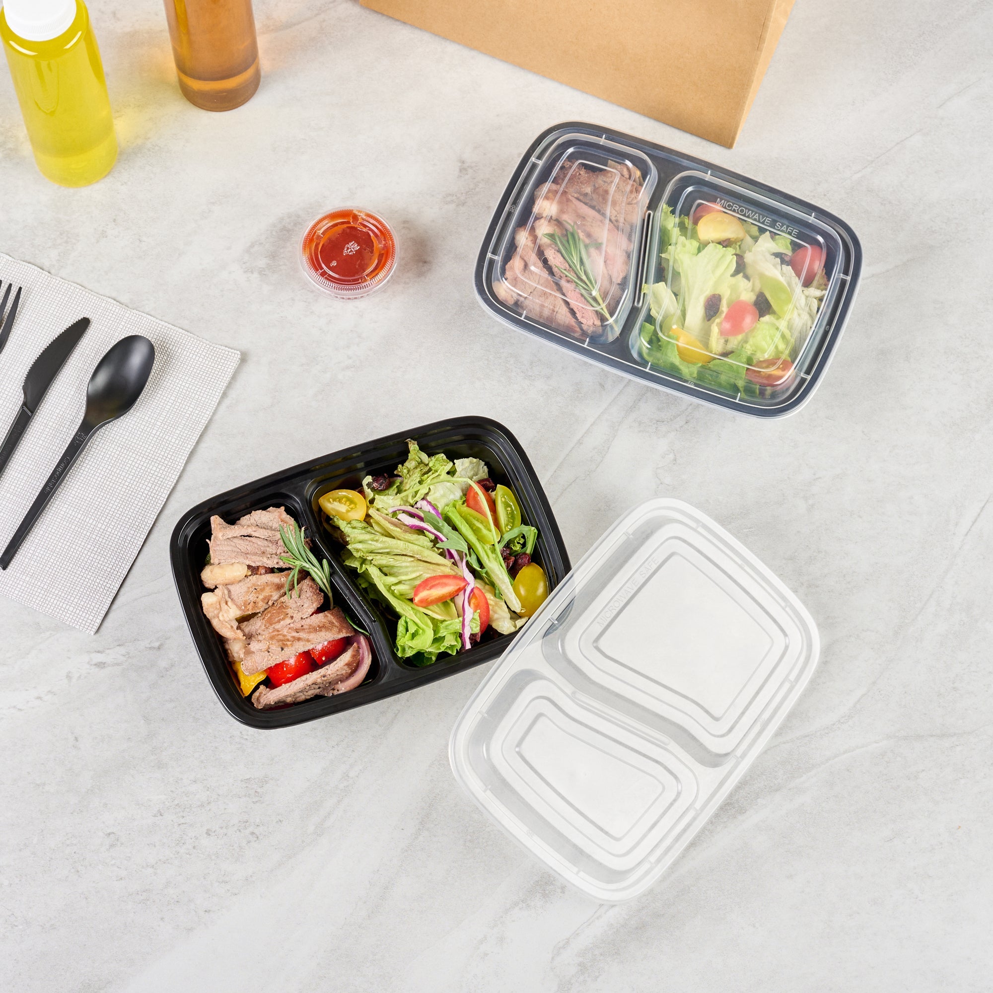 Asporto 32 oz Black Plastic 2 Compartment Food Container - with Clear Lid, Microwavable - 8 3/4" x 6" x 2" - 100 count box