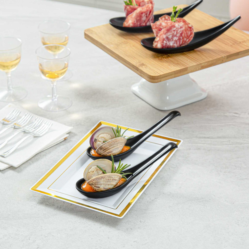 Voga 1 oz Black Melamine Tasting Spoon - Japonais, Curva - 5 3/4" x 1 1/2" x 1" - 10 count box