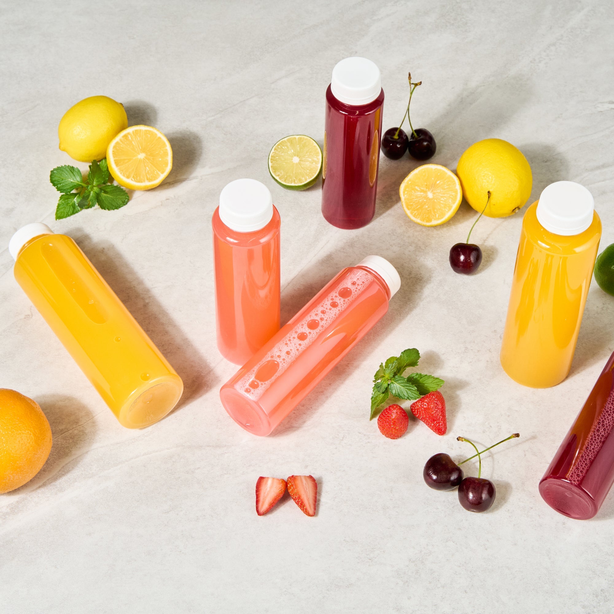 Bottle Tek 12 oz Round Clear Plastic Cold Pressed Juice Bottle - with Safety Cap - 2" x 2" x 7 1/4" - 100 count box