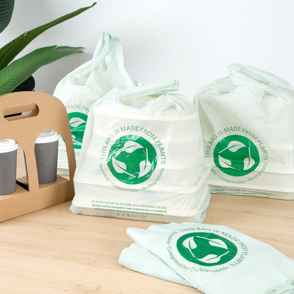 Basic Nature Green Plastic T-Shirt Bag - 1/6 Size, Compostable - 12" x 6 1/2" x 22" - 500 count box