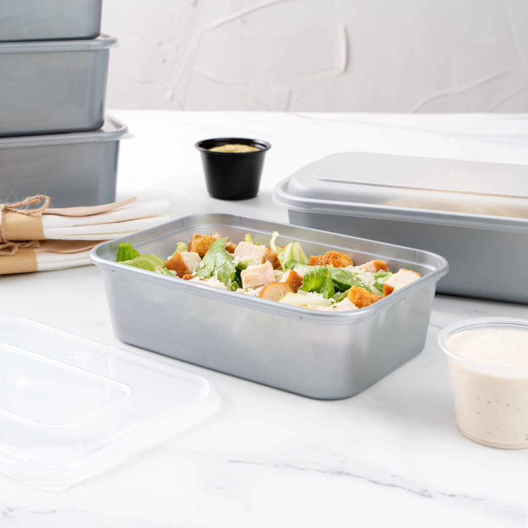 Futura 22 oz Silver Plastic Take Out Container - with Clear Lid, Microwavable - 6 3/4" x 4 1/2" x 2 1/4" - 100 count box