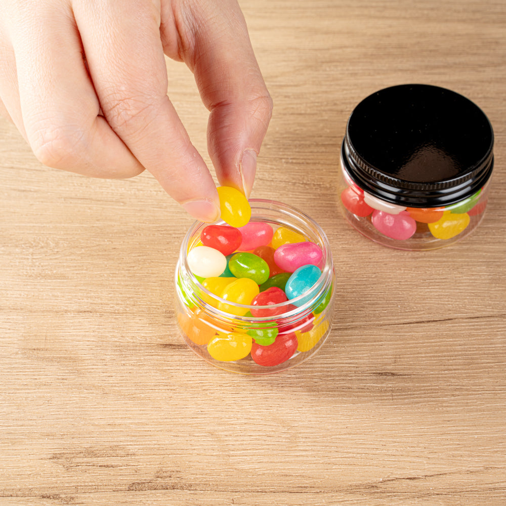 Chef 101 1 oz Round Clear Plastic Candy and Snack Jar - with Black Aluminum Lid - 2" x 2" x 1 1/4" - 10 count box