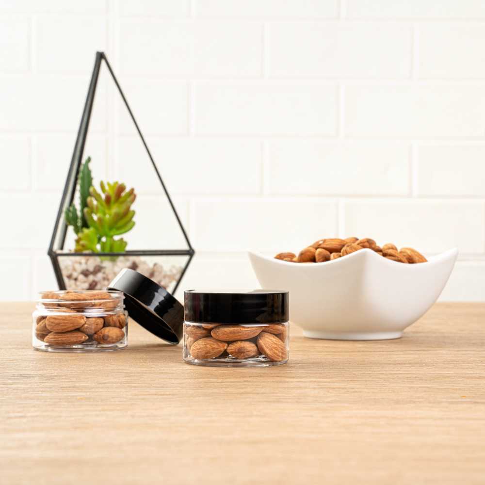 Chef 101 1 oz Round Clear Plastic Candy and Snack Jar - with Black Plastic Lid - 2" x 2" x 1 1/4" - 100 count box