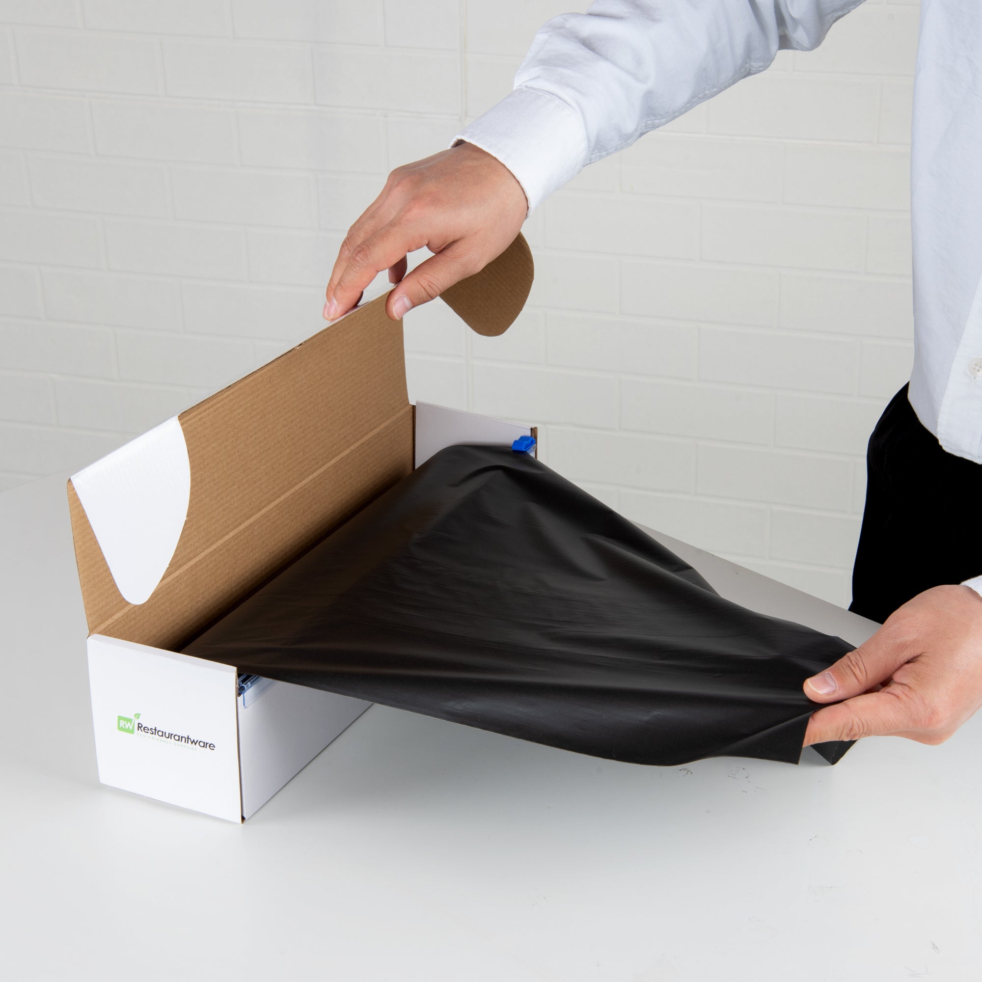 Table Tek Black Plastic Table Cover Roll - with Slide Cutter - 100' x 54" - 10 count box