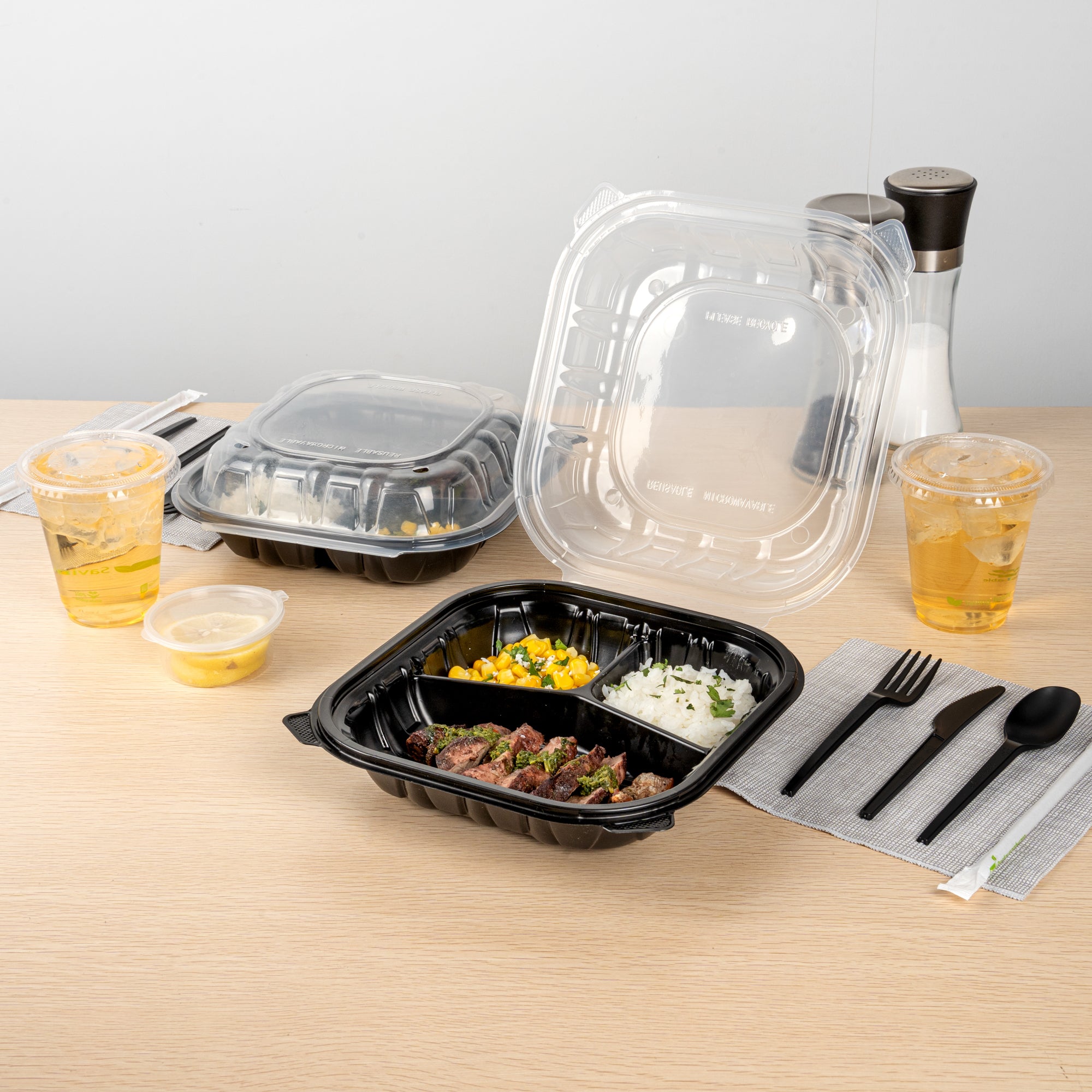 Thermo Tek 40 oz Black Plastic Clamshell Container - 3 Compartments, Microwavable - 9" x 9" x 3" - 50 count box