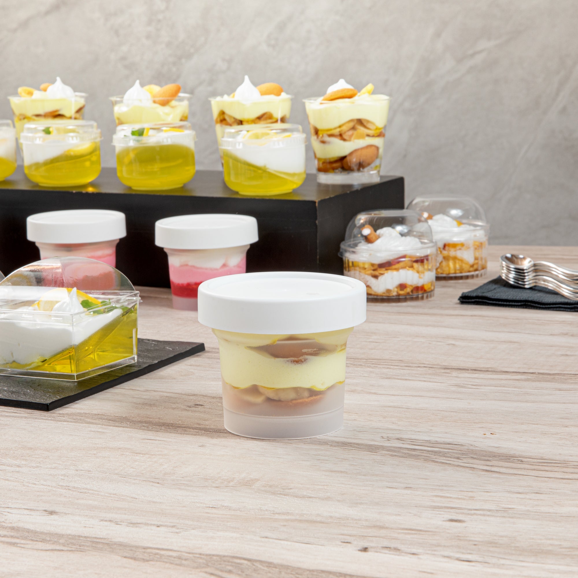 Mini Serve 8 oz Round Clear Plastic Dessert Cup - with Lid - 3 1/2'' x 3 1/2'' x 3'' - 25 count box
