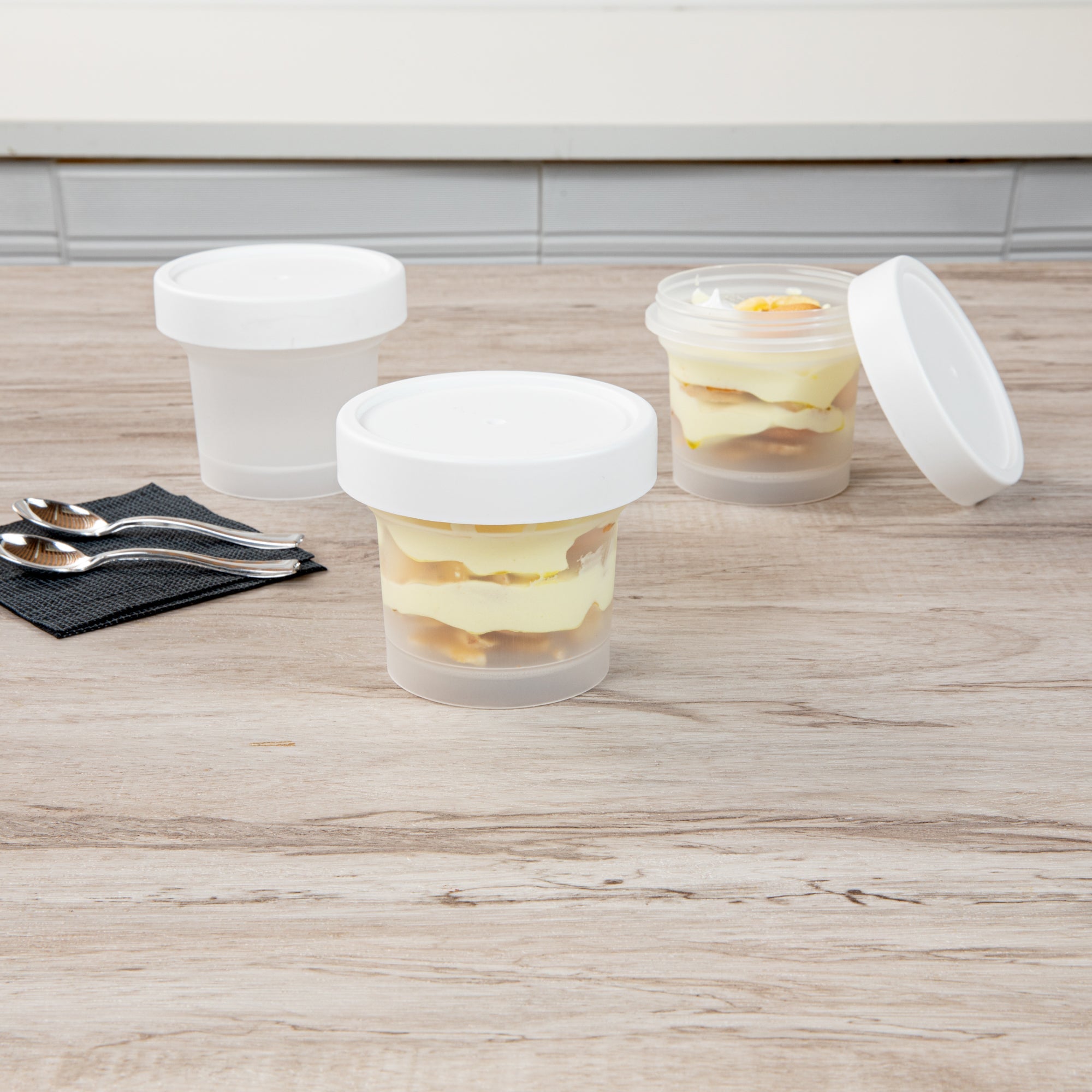 Mini Serve 8 oz Round Clear Plastic Dessert Cup - with Lid - 3 1/2'' x 3 1/2'' x 3'' - 100 count box