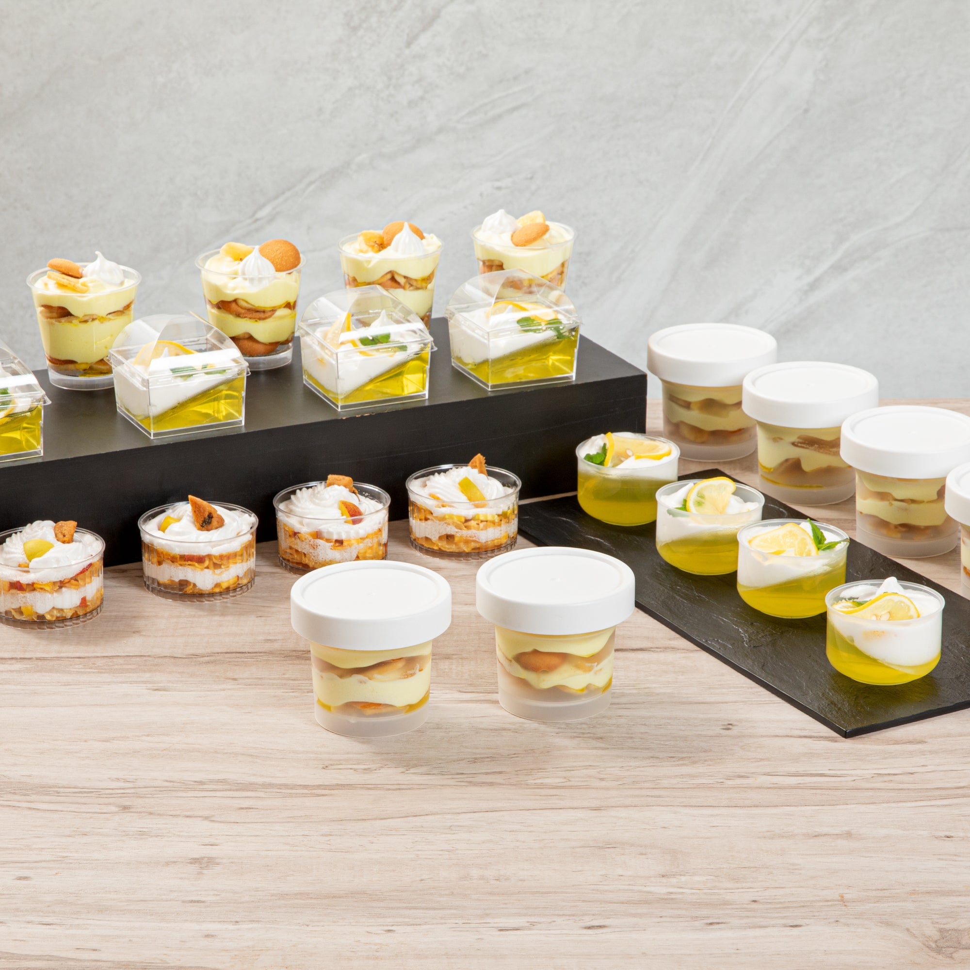 Mini Serve 8 oz Round Clear Plastic Dessert Cup - with Lid - 3 1/2'' x 3 1/2'' x 3'' - 100 count box