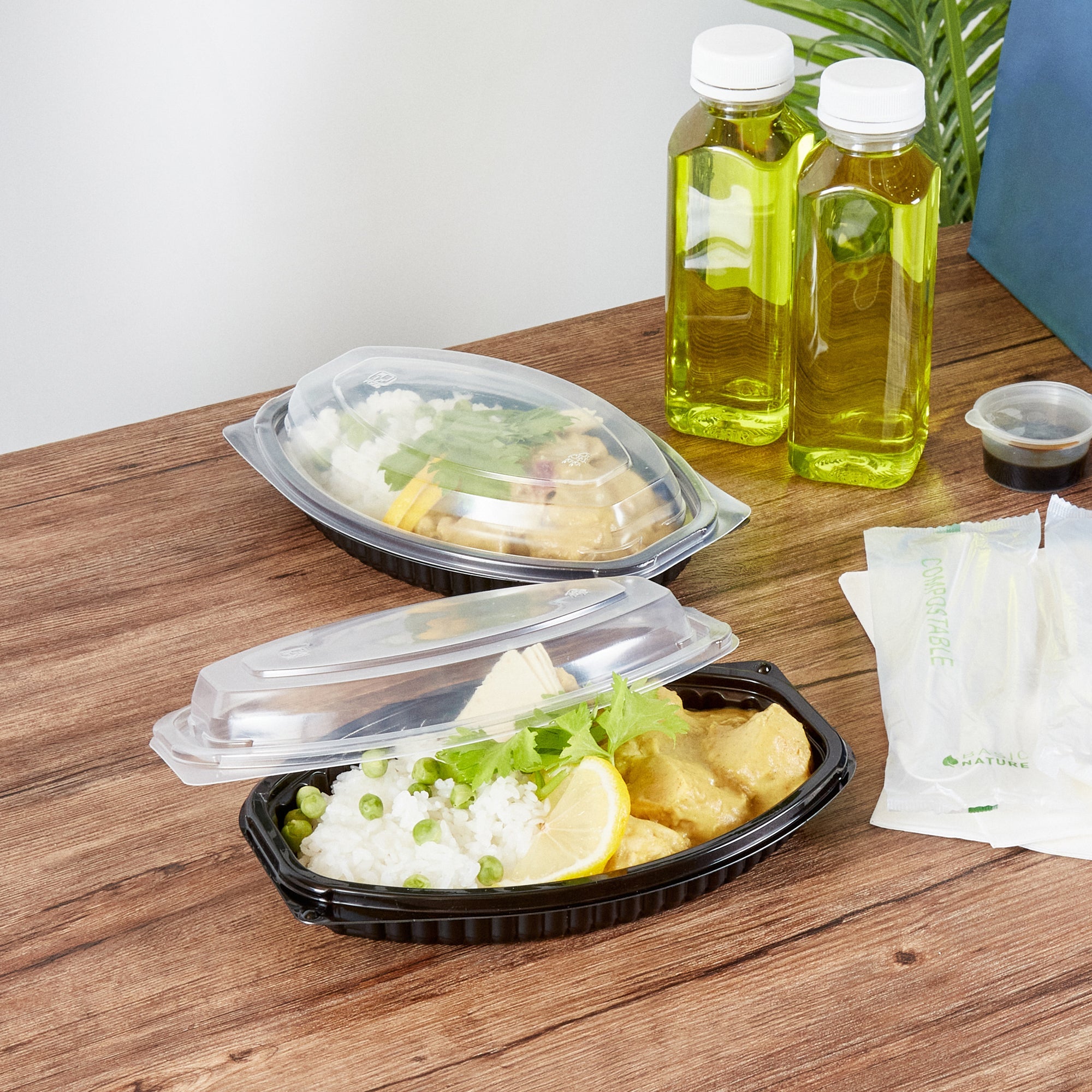 Chef 101 12 oz Oval Black Plastic Food Container - with Clear Lid, Microwavable - 8" x 5 1/2" x 2" - 50 count box