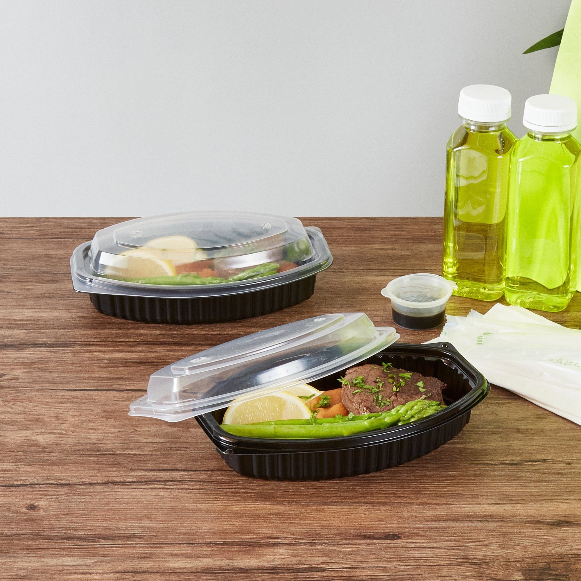 Chef 101 16 oz Oval Black Plastic Food Container - with Clear Lid, Microwavable - 8" x 5 1/2" x 2 1/4" - 100 count box