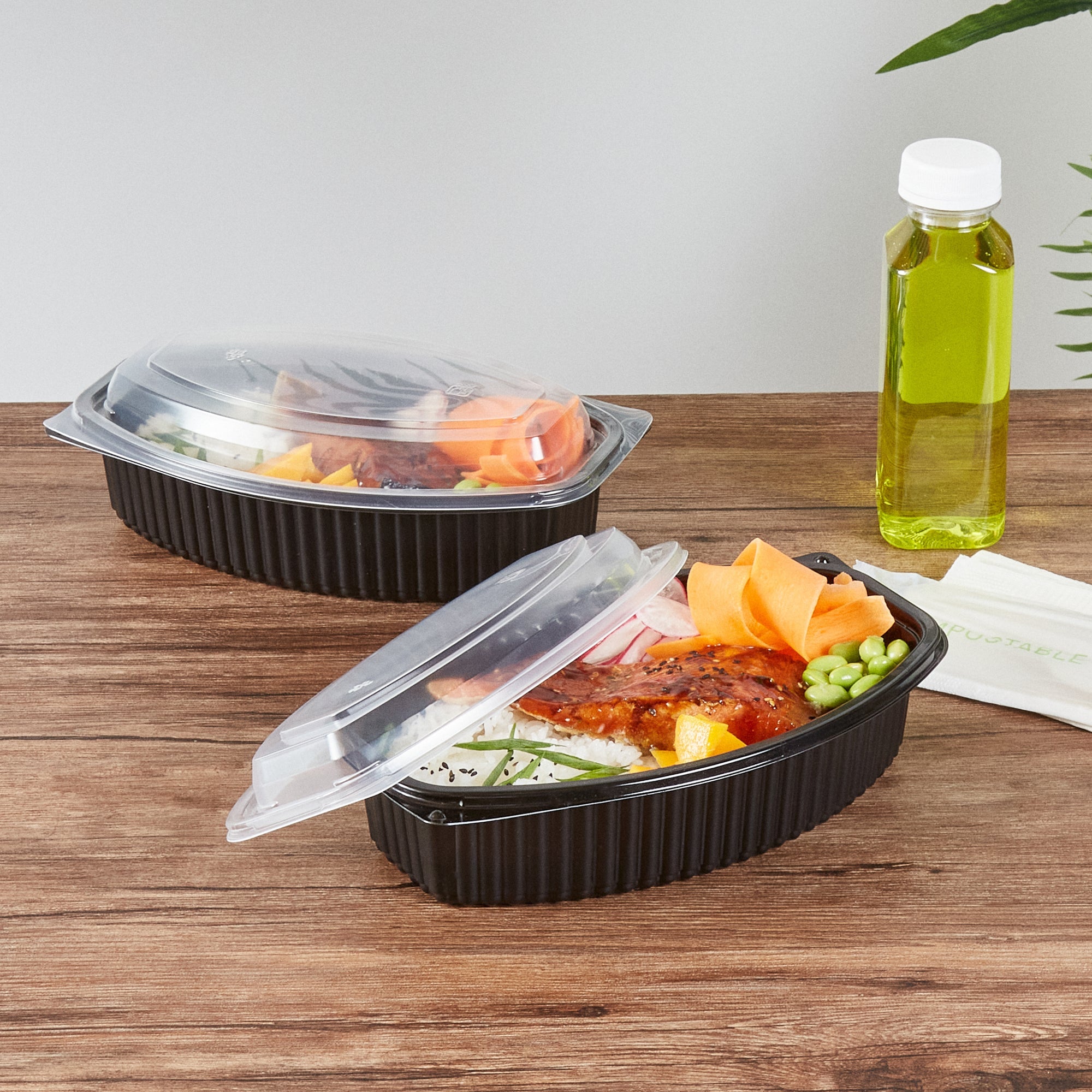 Chef 101 32 oz Oval Black Plastic Food Container - with Clear Lid, Microwavable - 9 1/4" x 5 3/4" x 3" - 100 count box