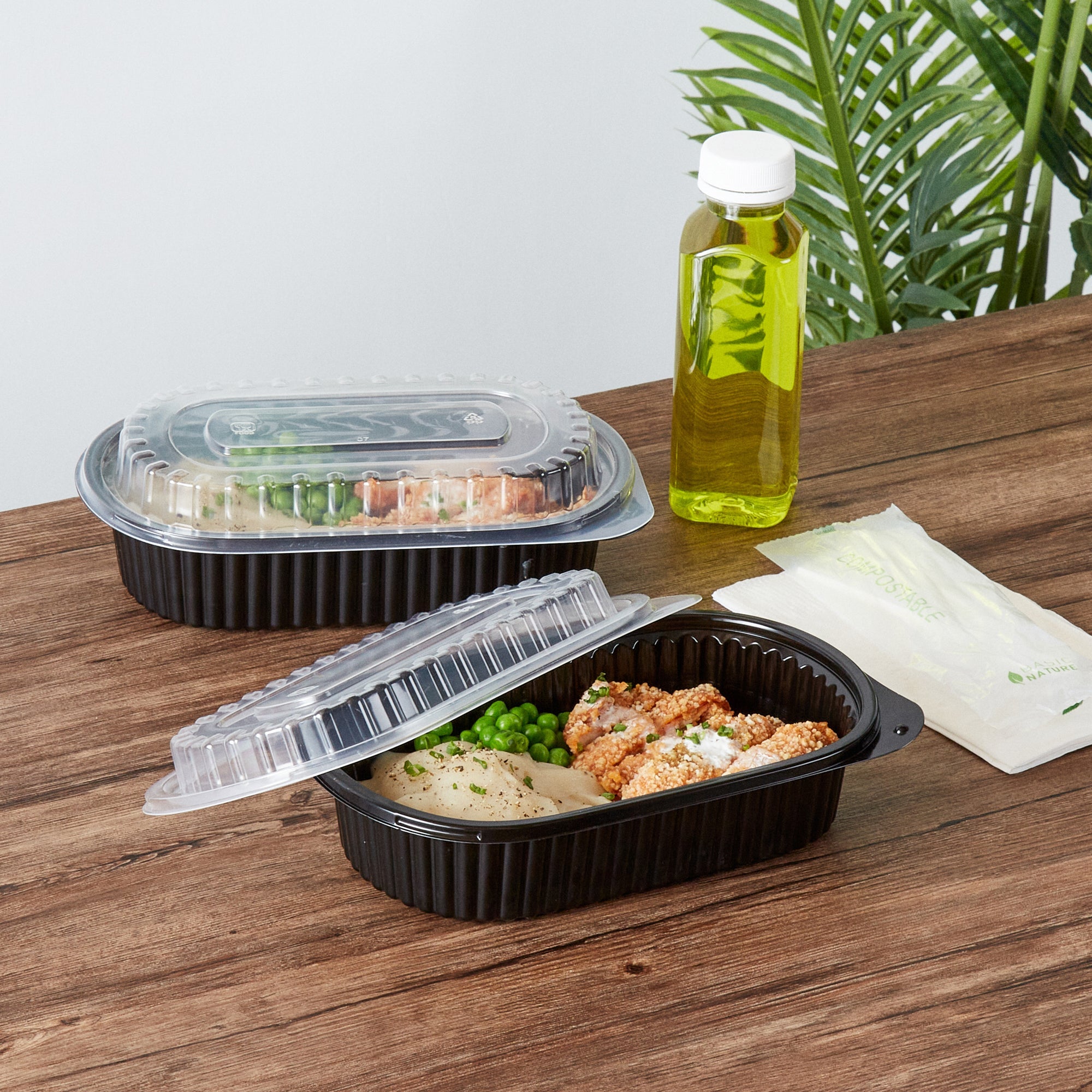 Chef 101 32 oz Oval Black Plastic Food Container - with Clear Dome Lid, Microwavable - 9 1/4" x 6" x 2 1/2" - 100 count box