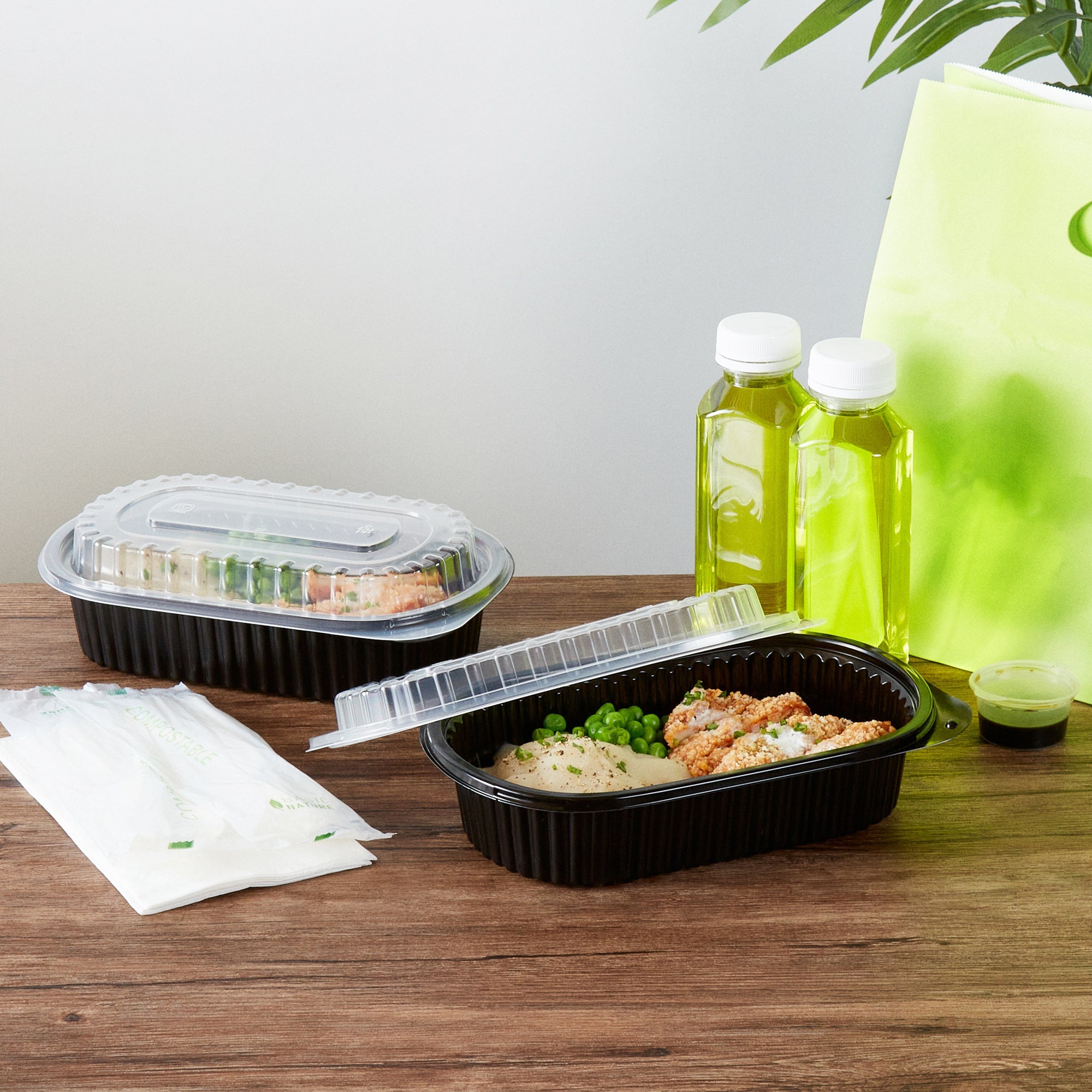 Chef 101 32 oz Oval Black Plastic Food Container - with Clear Dome Lid, Microwavable - 9 1/4" x 6" x 2 1/2" - 100 count box