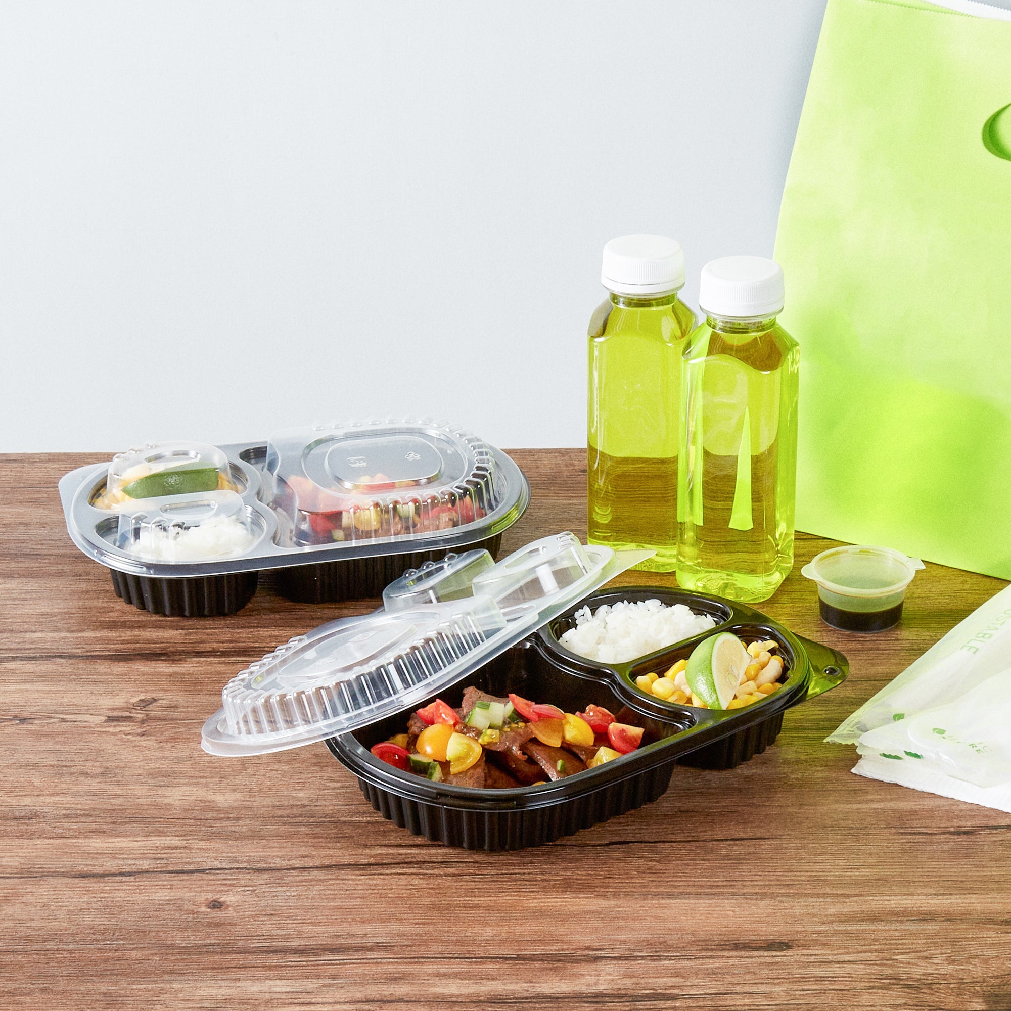 Chef 101 19 oz Oval Black Plastic Food Container - with Clear Lid, 3 Compartments, Microwavable - 9 1/4" x 6" x 2 1/4" - 100 count box