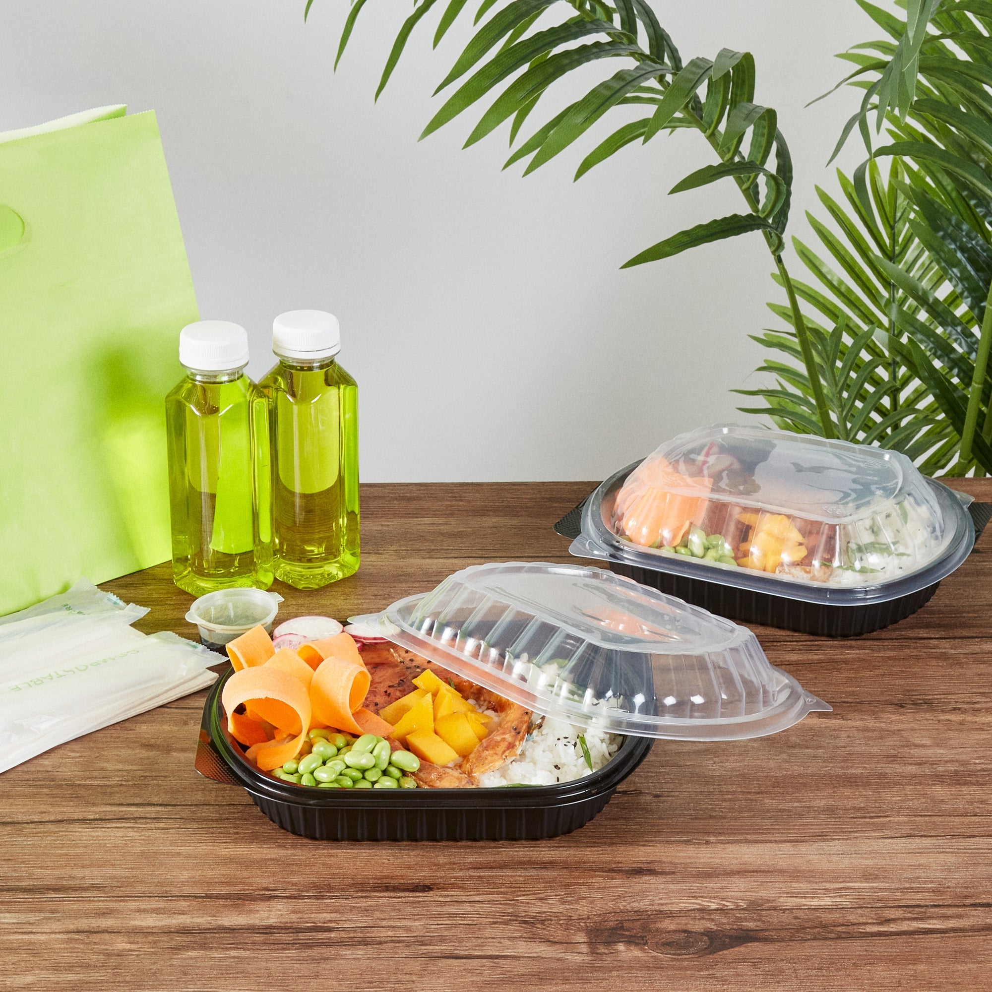 Chef 101 34 oz Oval Black Plastic Food Container - with Clear Lid, Microwavable - 9 1/2" x 8" x 2 3/4" - 50 count box