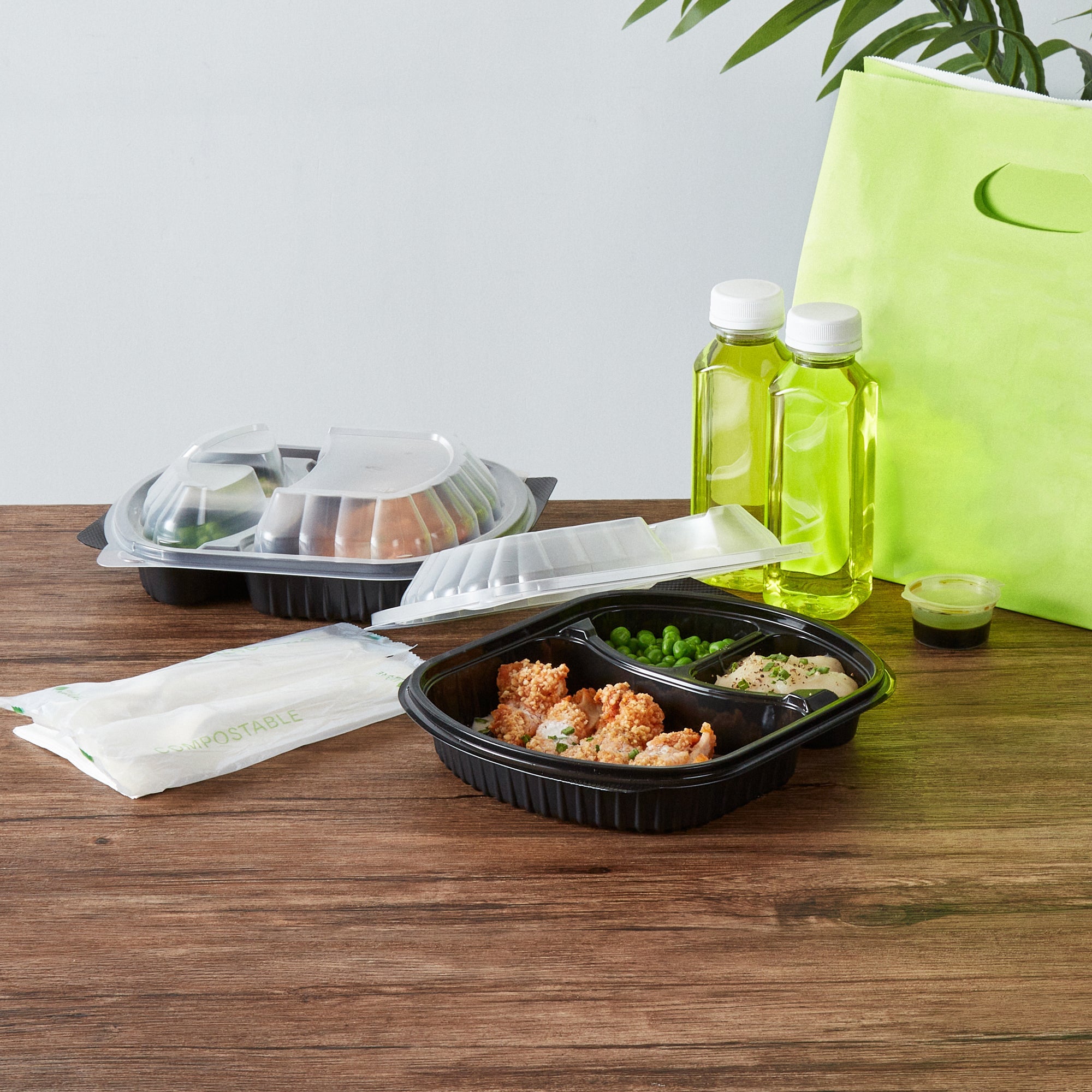 Chef 101 27 oz Oval Black Plastic Food Container - with Clear Lid, 3 Compartments, Microwavable - 9 1/2" x 8" x 2 3/4" - 100 count box