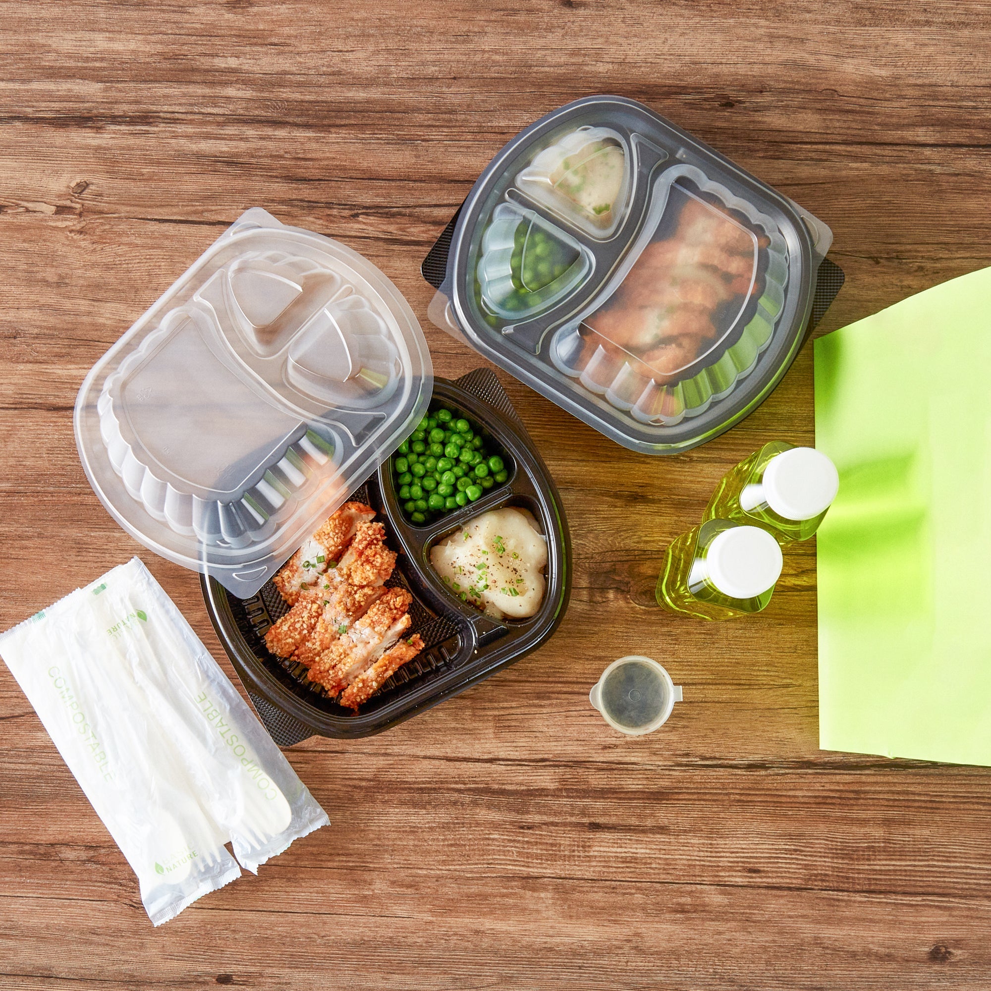 Chef 101 27 oz Oval Black Plastic Food Container - with Clear Lid, 3 Compartments, Microwavable - 9 1/2" x 8" x 2 3/4" - 100 count box