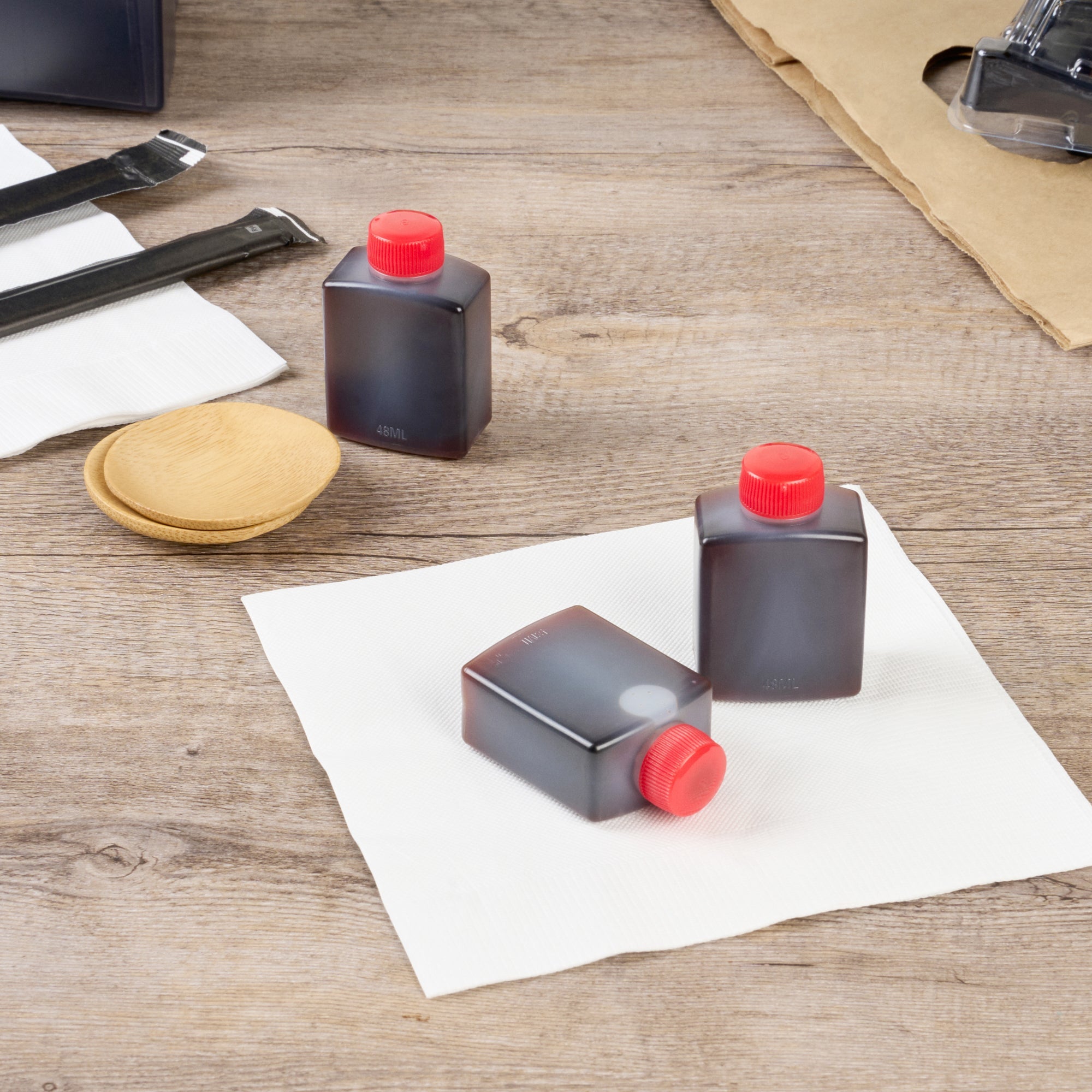 Bento Tek 2 oz Translucent Plastic Soy Sauce Bottle - with Red Cap - 1 1/2" x 1" x 2 1/2" - 100 count box