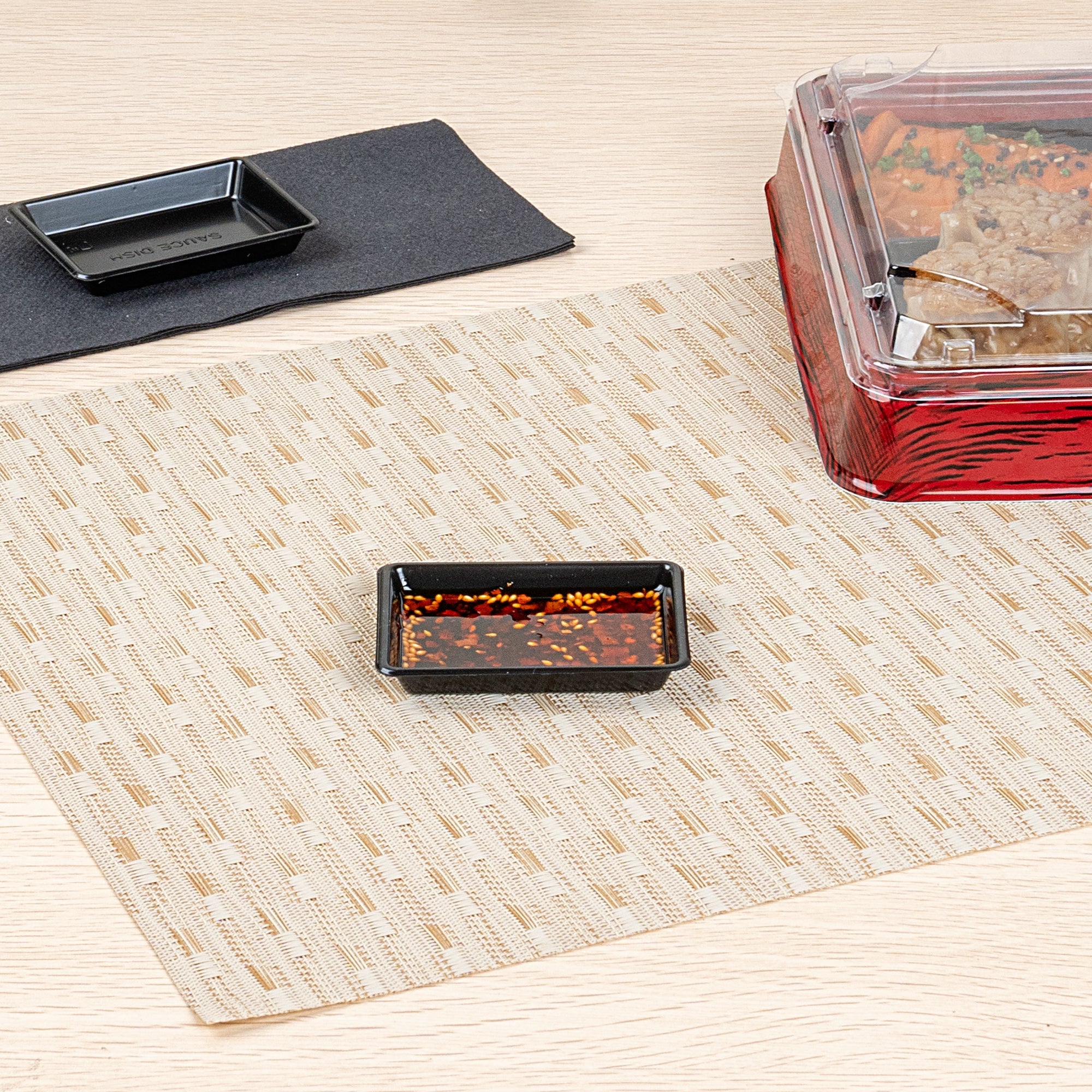 Bento Tek 1 oz Rectangle Black Plastic Sauce Dish - 3" x 2 1/4" - 100 count box