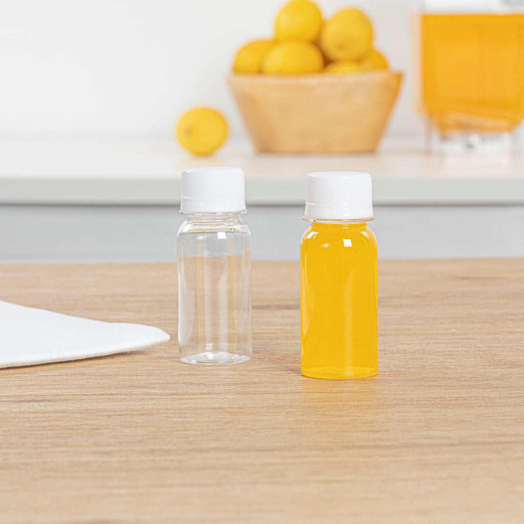 Bottle Tek 2 oz Clear Plastic Energy Shot Bottle - with Safety Cap - 1 1/2" x 1 1/2" x 3 3/4" - 100 count box