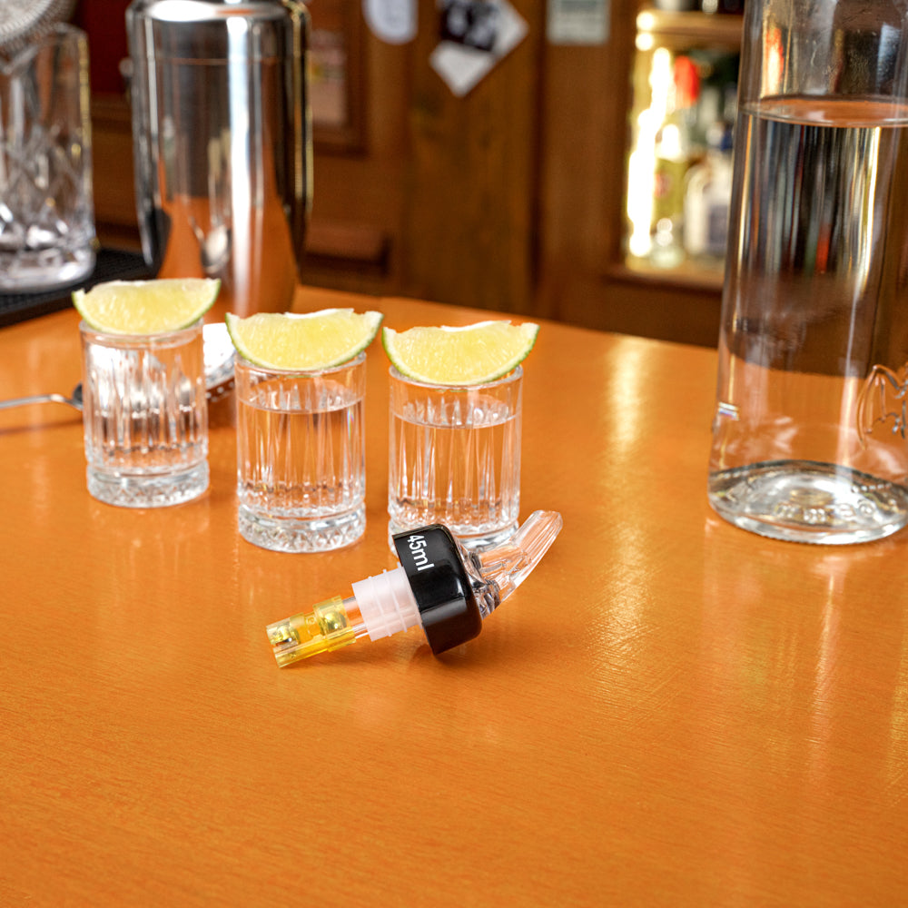 Bar Lux 1.5 oz Yellow Plastic Measured Liquor Pourer - with Collar, Clear Spout - 1 1/2" x 1 1/2" x 3 3/4" - 10 count box