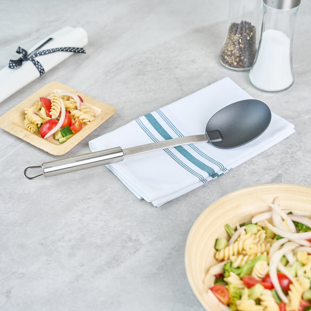 German Standard Black Nylon High Heat Solid Serving Spoon - with Stainless Steel Handle - 12 1/2'' x 2 1/2'' x 1 1/2'' - 1 count box