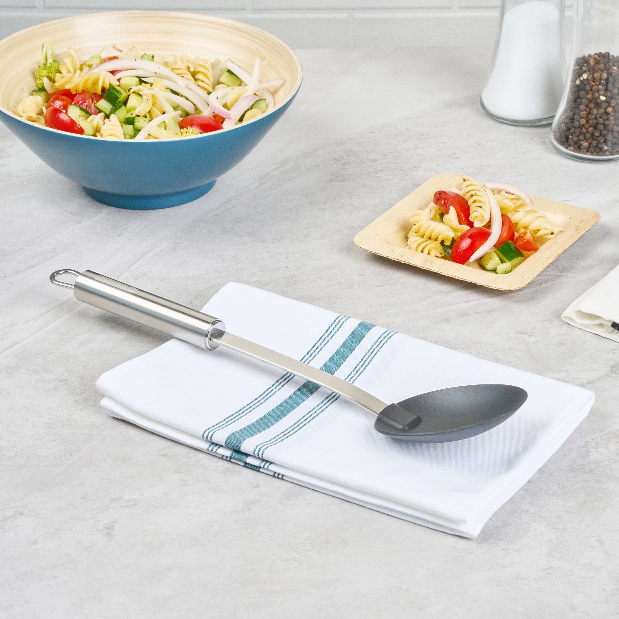 German Standard Black Nylon High Heat Solid Serving Spoon - with Stainless Steel Handle - 12 1/2'' x 2 1/2'' x 1 1/2'' - 1 count box