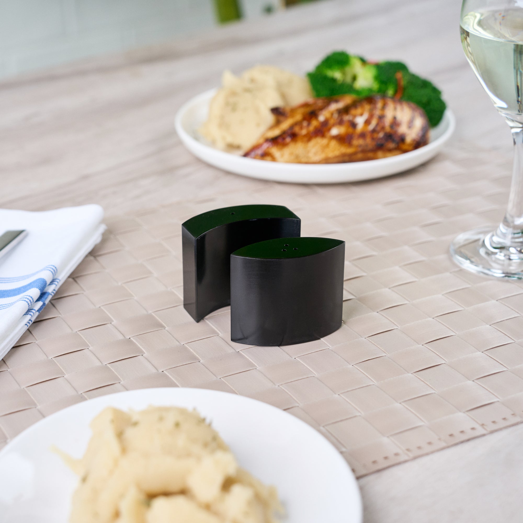 Chef 101 4 oz Black Stainless Steel Embracing Salt And Pepper Shaker Set - 2.3 oz/2.1 oz - 2 1/2" x 2" x 1 3/4" - 1 count box
