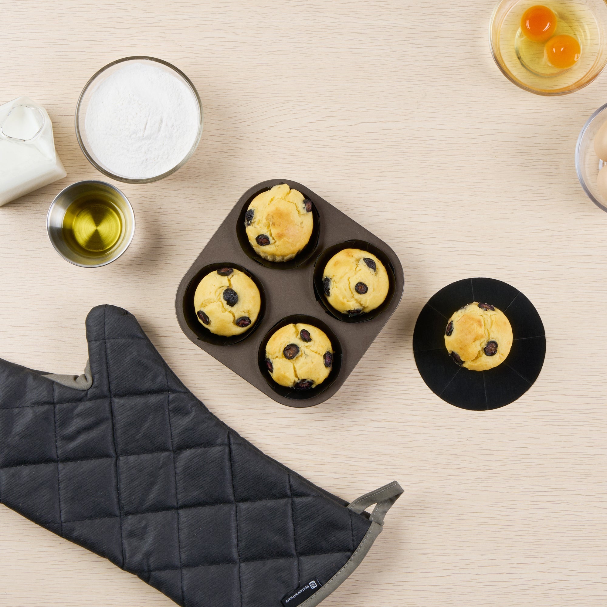 Pastry Tek Round Black Fiberglass Cupcake / Muffin Liner - Non-Stick, Foldable - 2" x 2" - 12 count box