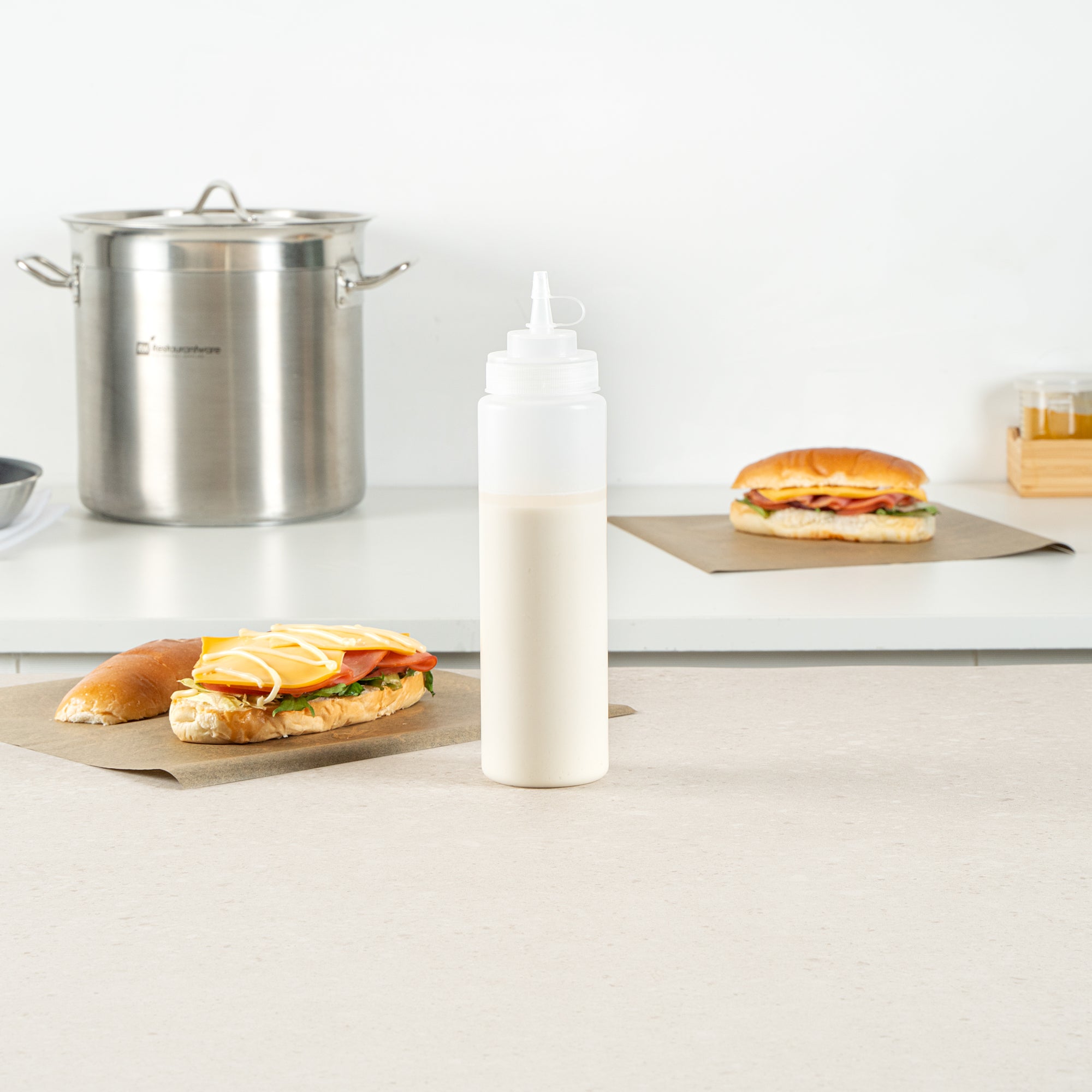 Sauce Tek 24 oz Clear Plastic Squeeze Bottle - with Cap, Wide Mouth - 2 1/2" x 2 1/2" x 10 1/4" - 1 count box