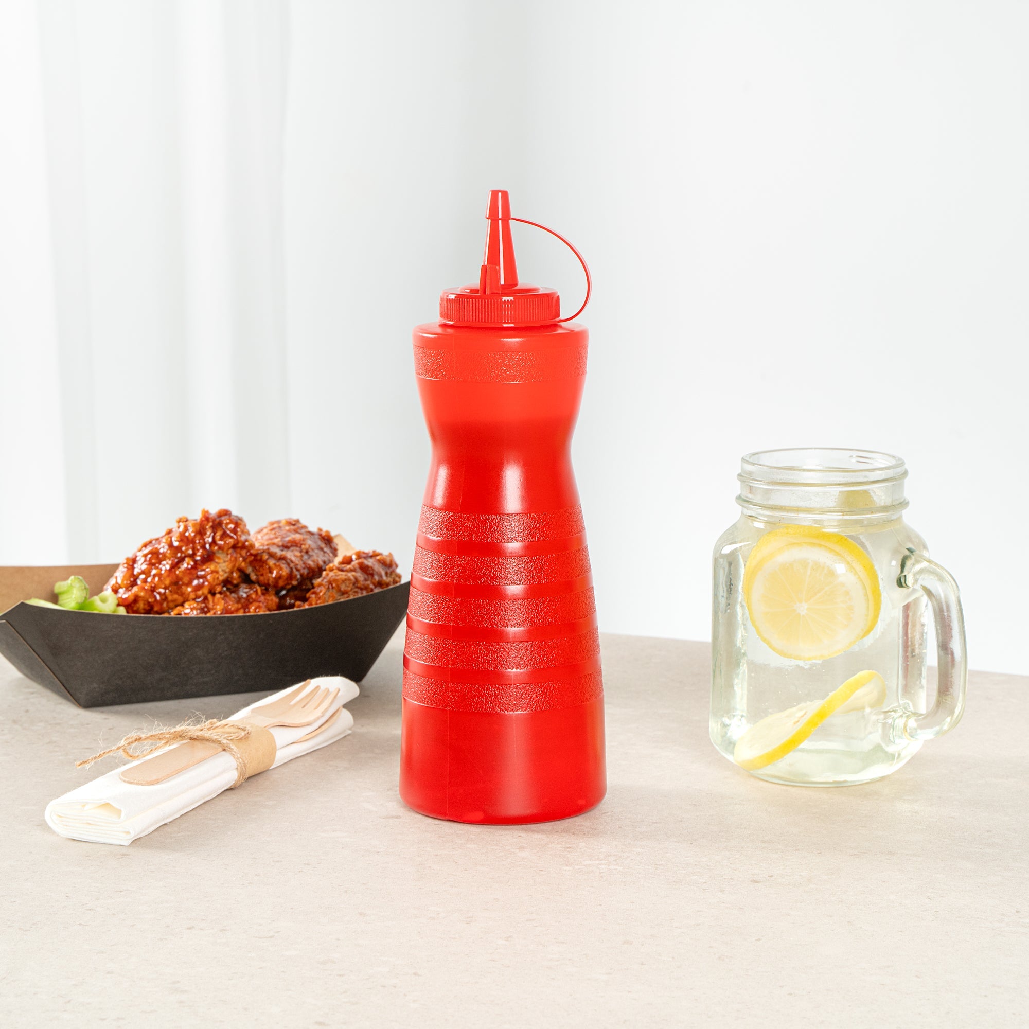 Sauce Tek 24 oz Red Plastic Squeeze Bottle - with Cap - 2 3/4" x 2 3/4" x 10 1/4" - 1 count box